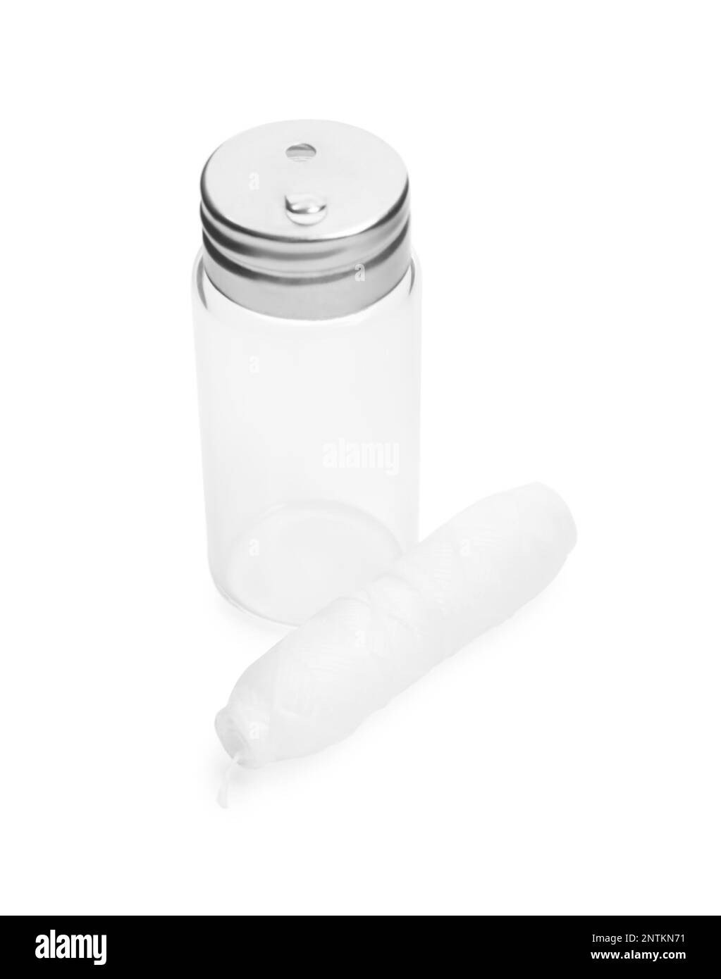 Roll of natural dental floss and jar on white background Stock Photo