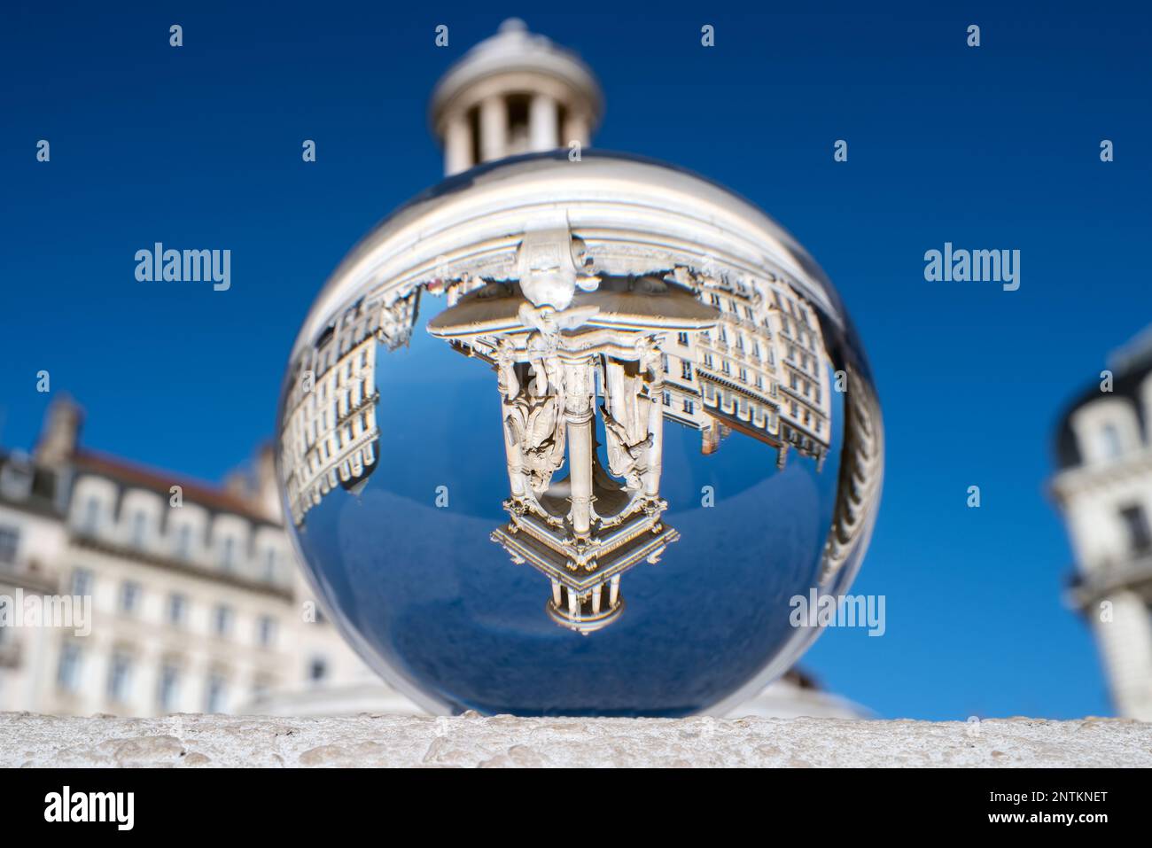 View of famous Jacobins Fountain through crystal ball in Lyon, France Stock Photo
