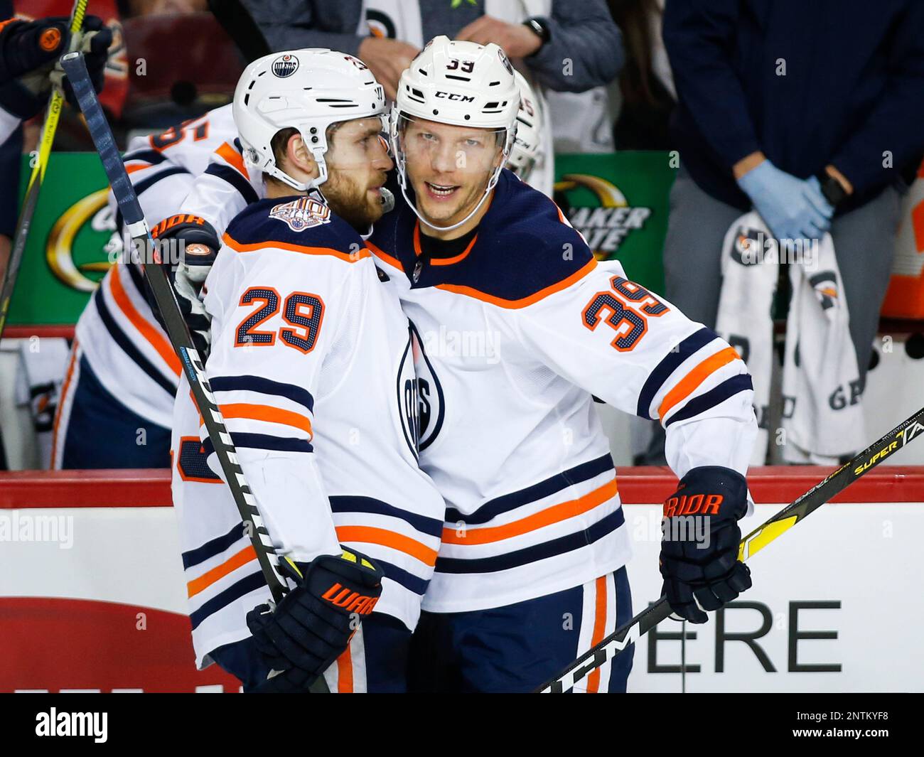 Edmonton Oilers' Leon Draisaitl, left, celebrates his goal against the