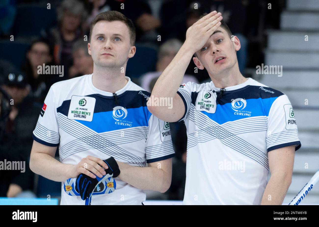 Scotland skip Bruce Mouat, left, directs his teammates against China at the mens world curling championships in Calgary, Alberta, Sunday, April 4, 2021