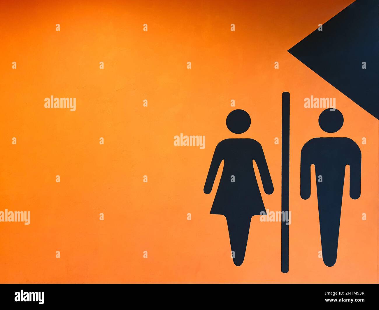 Toilet wc restroom sign man and woman icon graphic on orange wall Stock ...