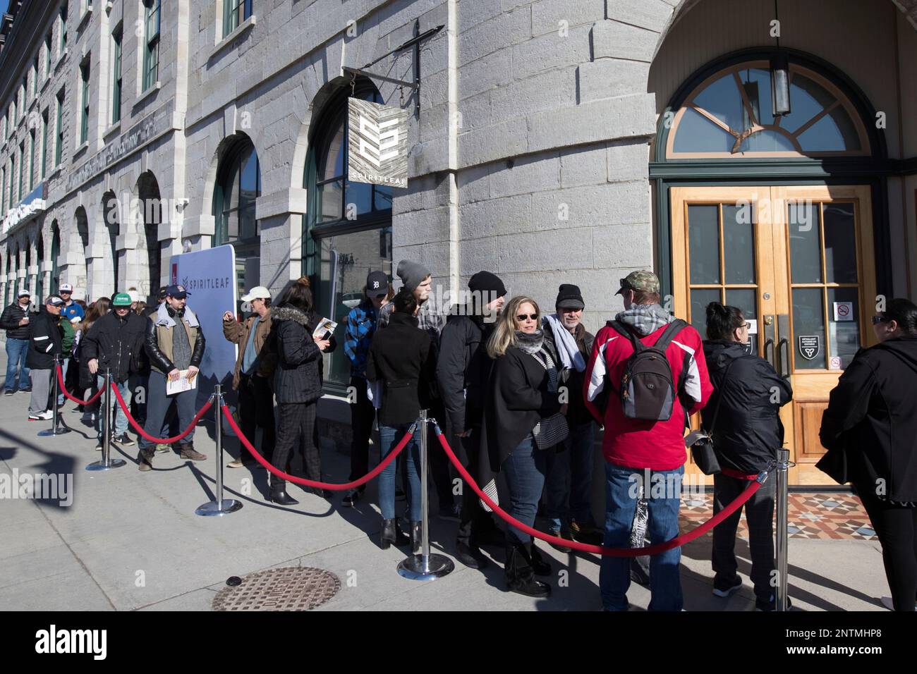 People wait in for the opening of the cannabis store Spiritleaf, the first cannabis store in