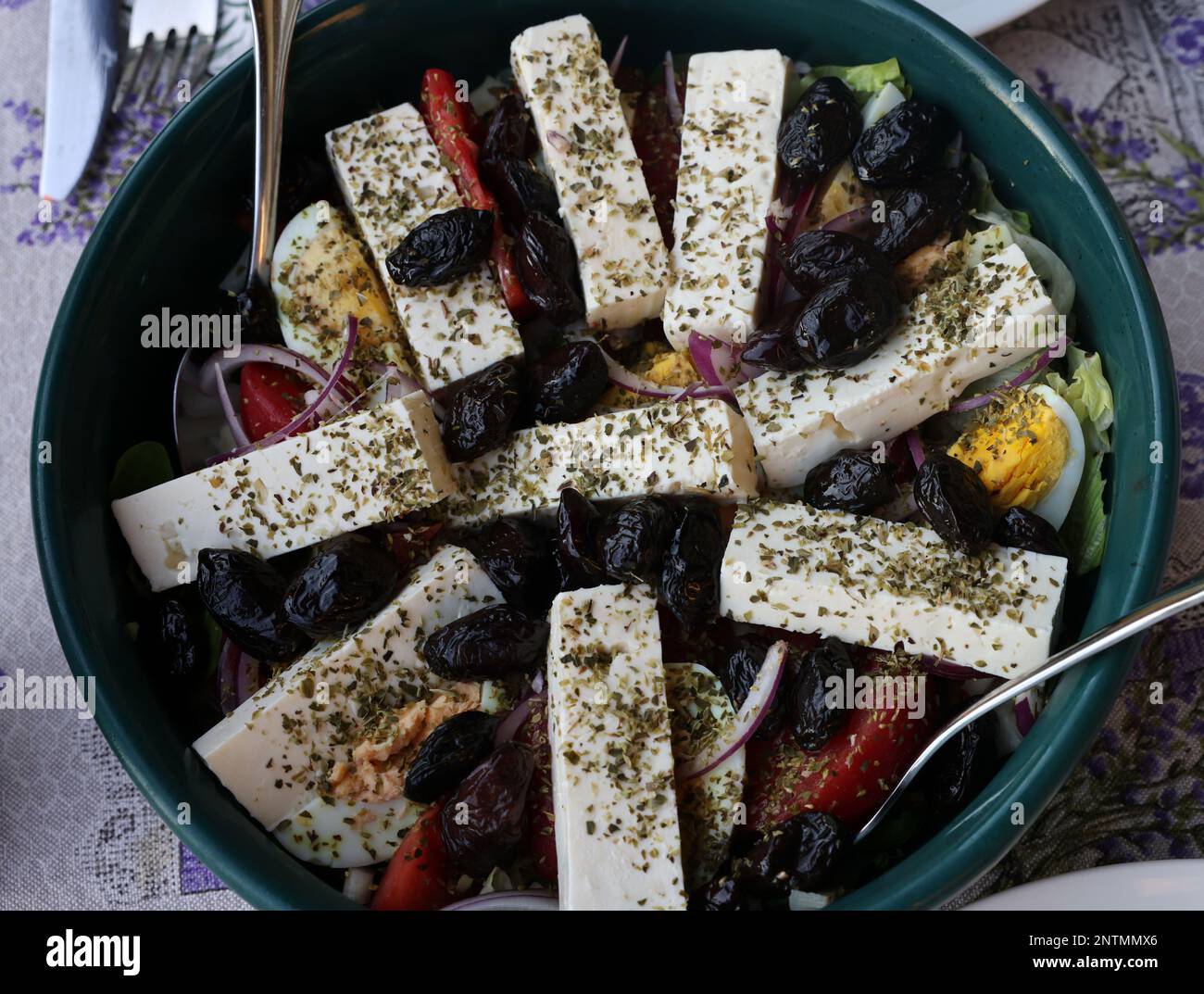 Greek salad with feta cheese and black olives. Typical delicious greek