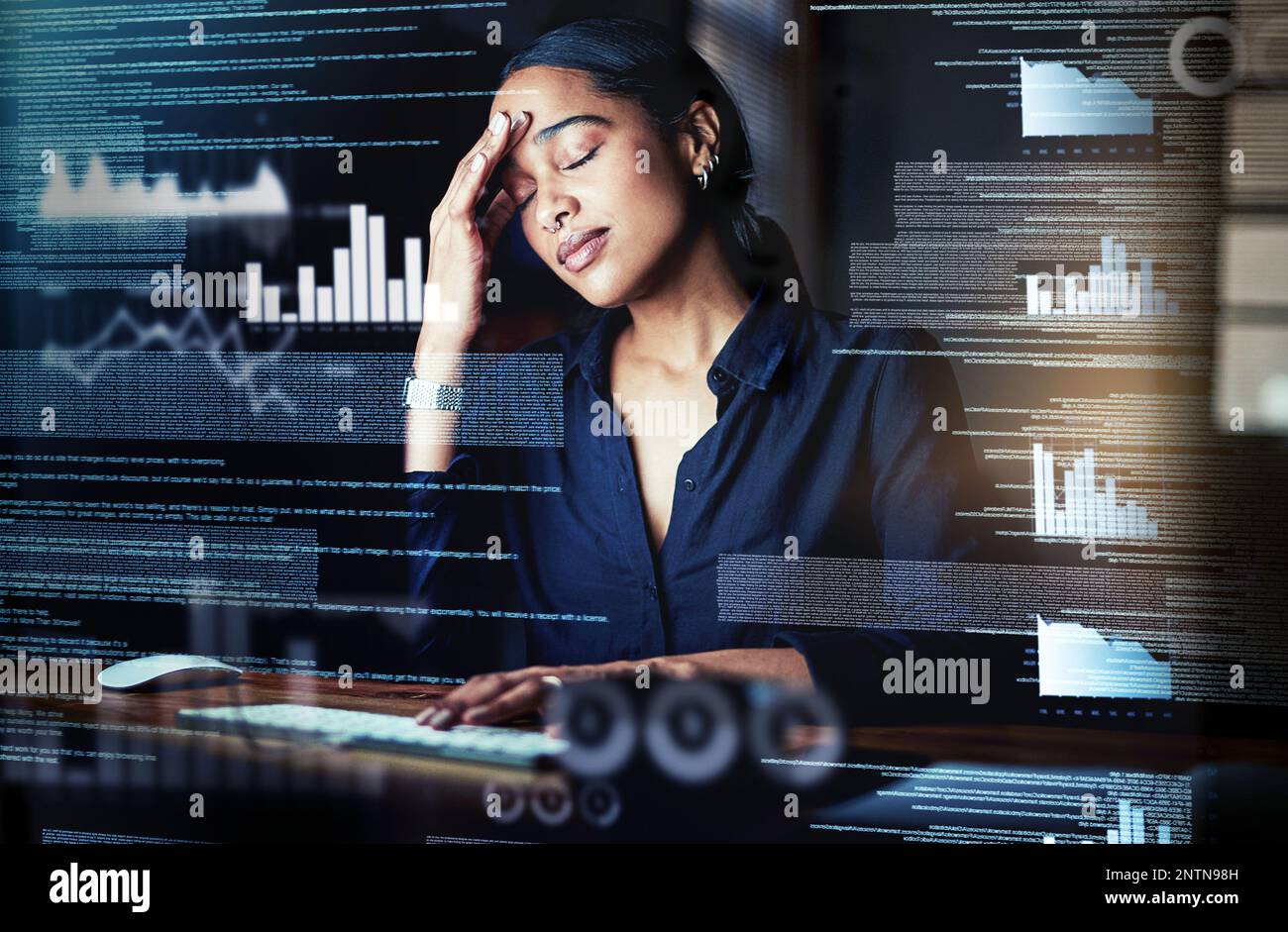 I dont think I can crack this. Shot of a programmer looking stressed out while working on a computer code at night. Stock Photo