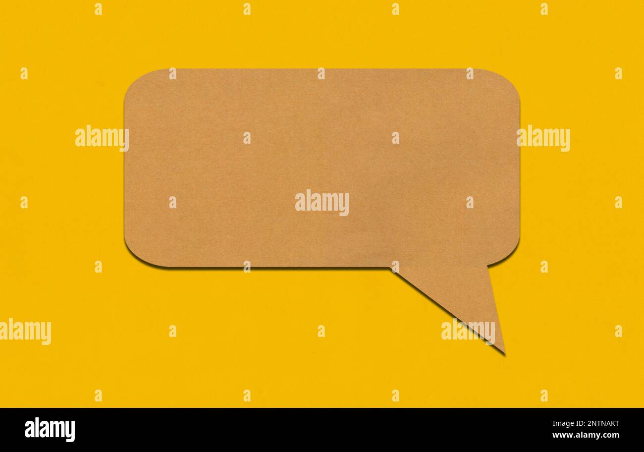 Brown paper speech bubble on yellow paper background. Paper blank of ...