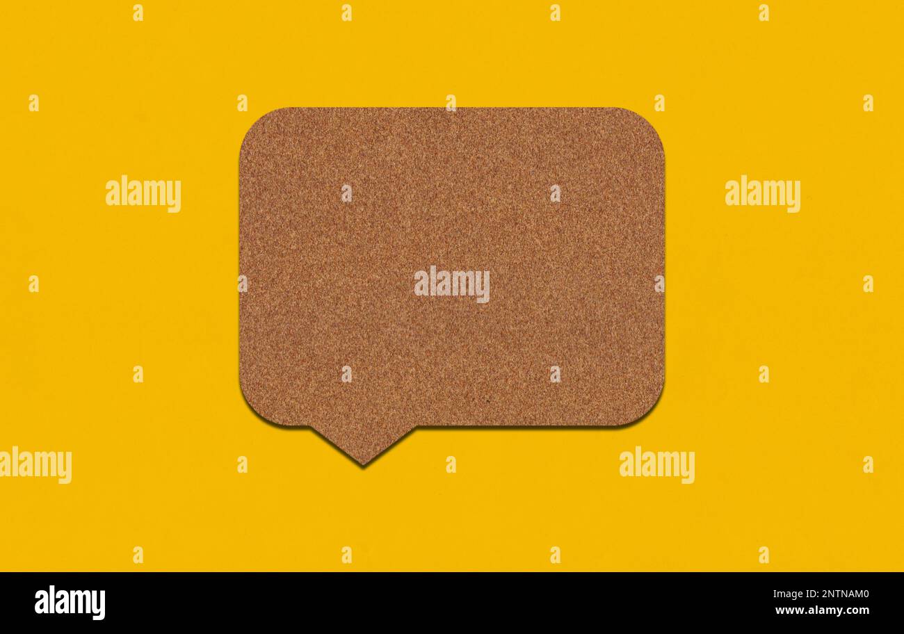 Brown paper speech bubble on yellow paper background. Paper blank of ...