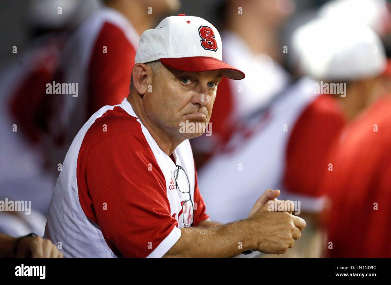 In this June 1, 2018, photo, North Carolina State NCAA college baseball  coach Elliott Avent watches from the dugout during a game against Army, in  Raleigh, . North Carolina State is the