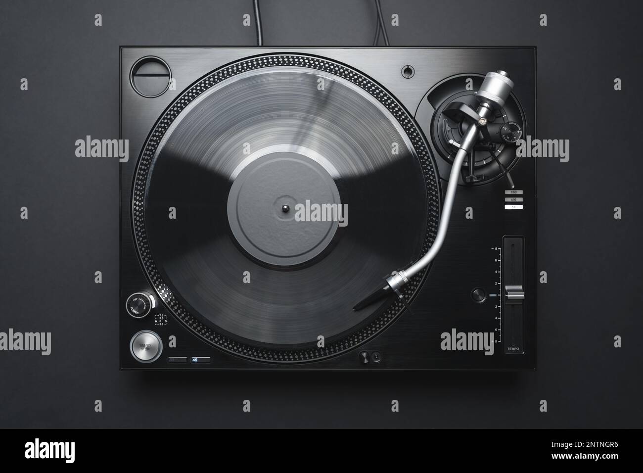 Dj turntable in flay lay. Turn table playing vinyl record with music. Stock Photo