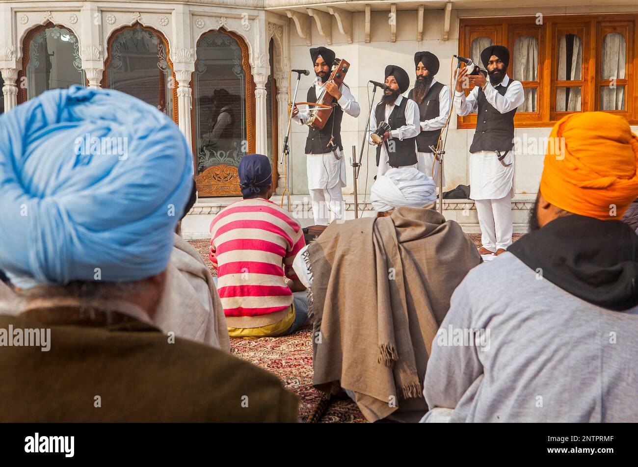 Musicians and story tellers with traditional Punjabi instruments, and