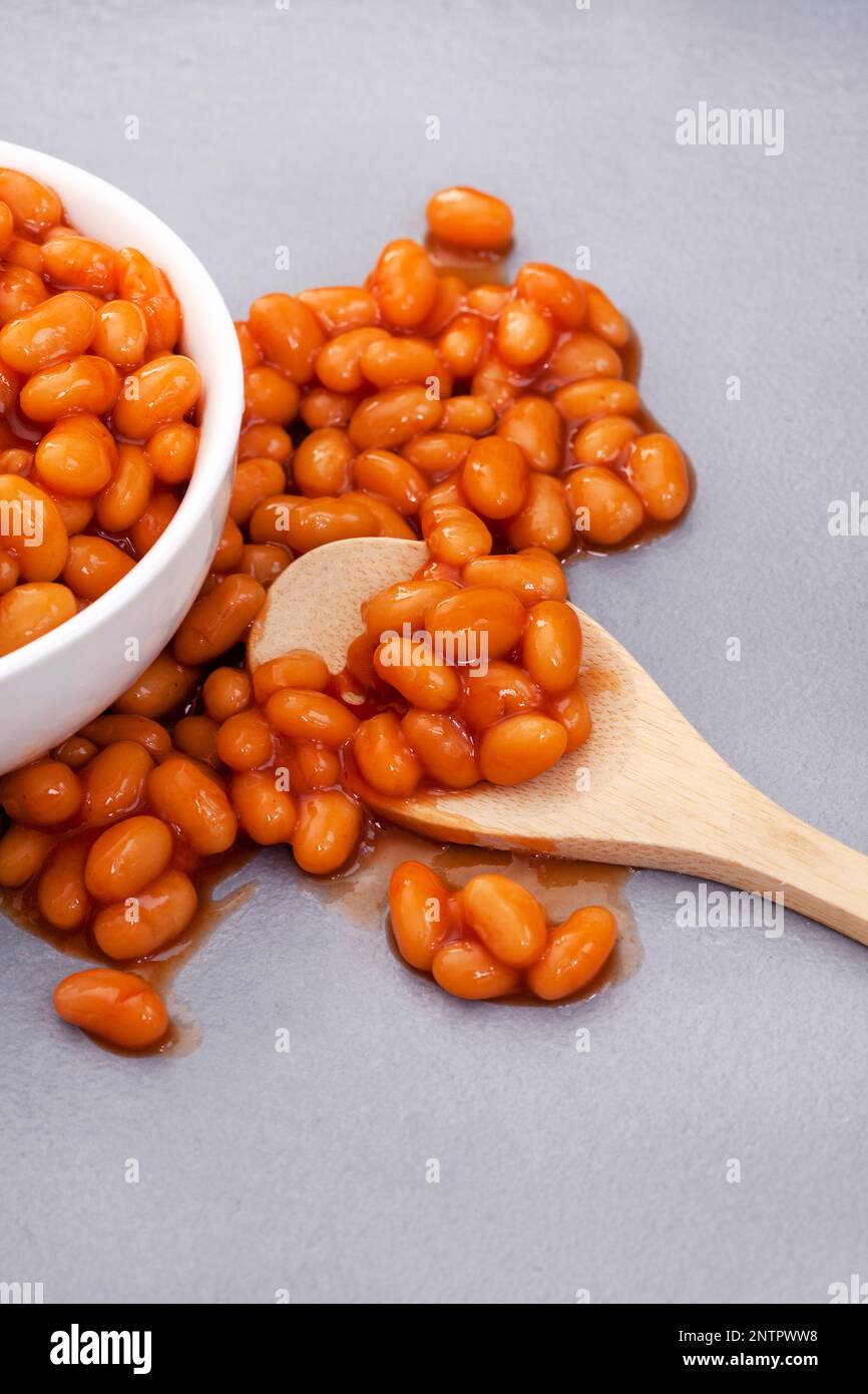 Baked beans from a can on grey surface Stock Photo Alamy