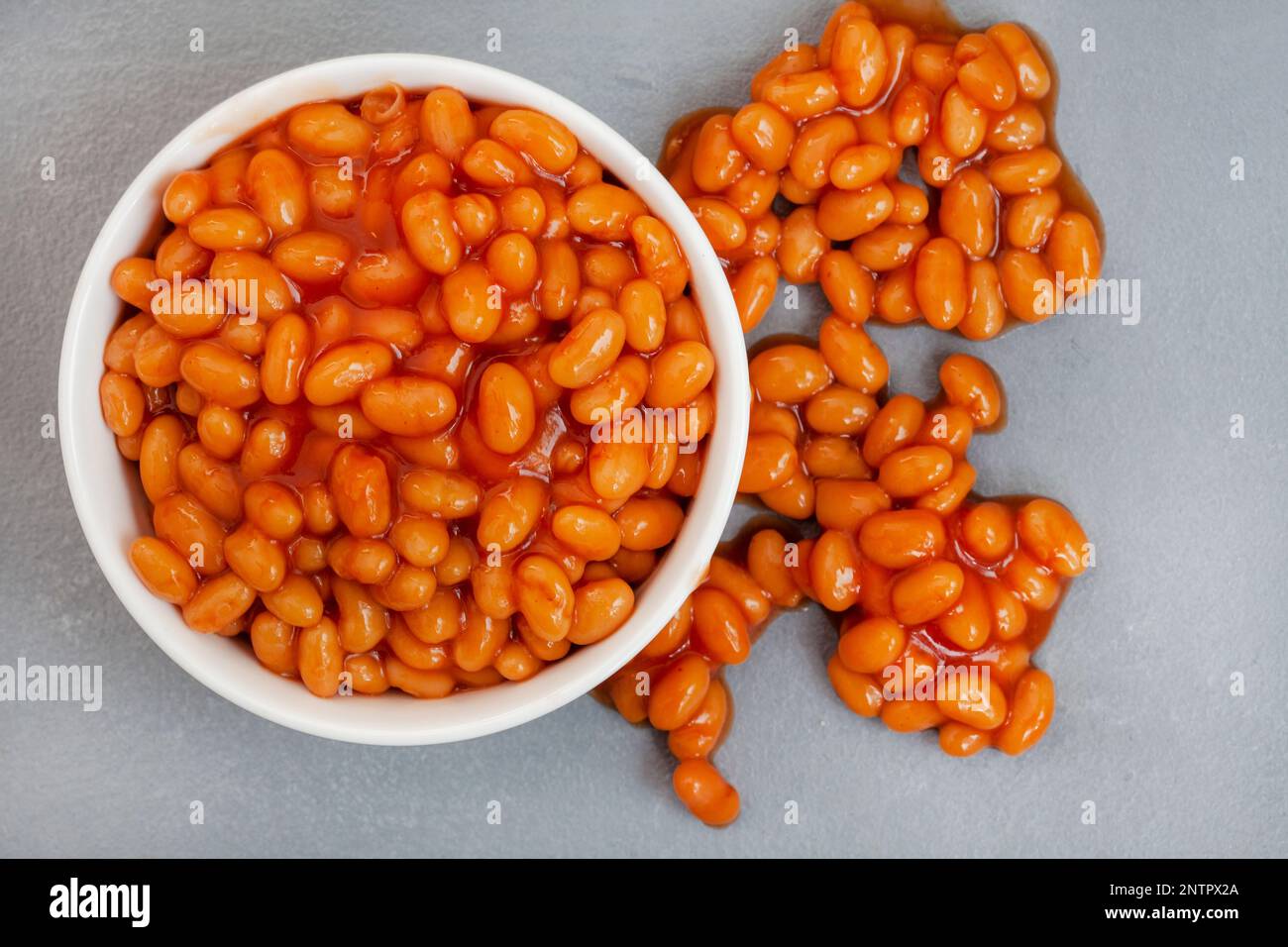 Baked beans from a can on grey surface Stock Photo Alamy