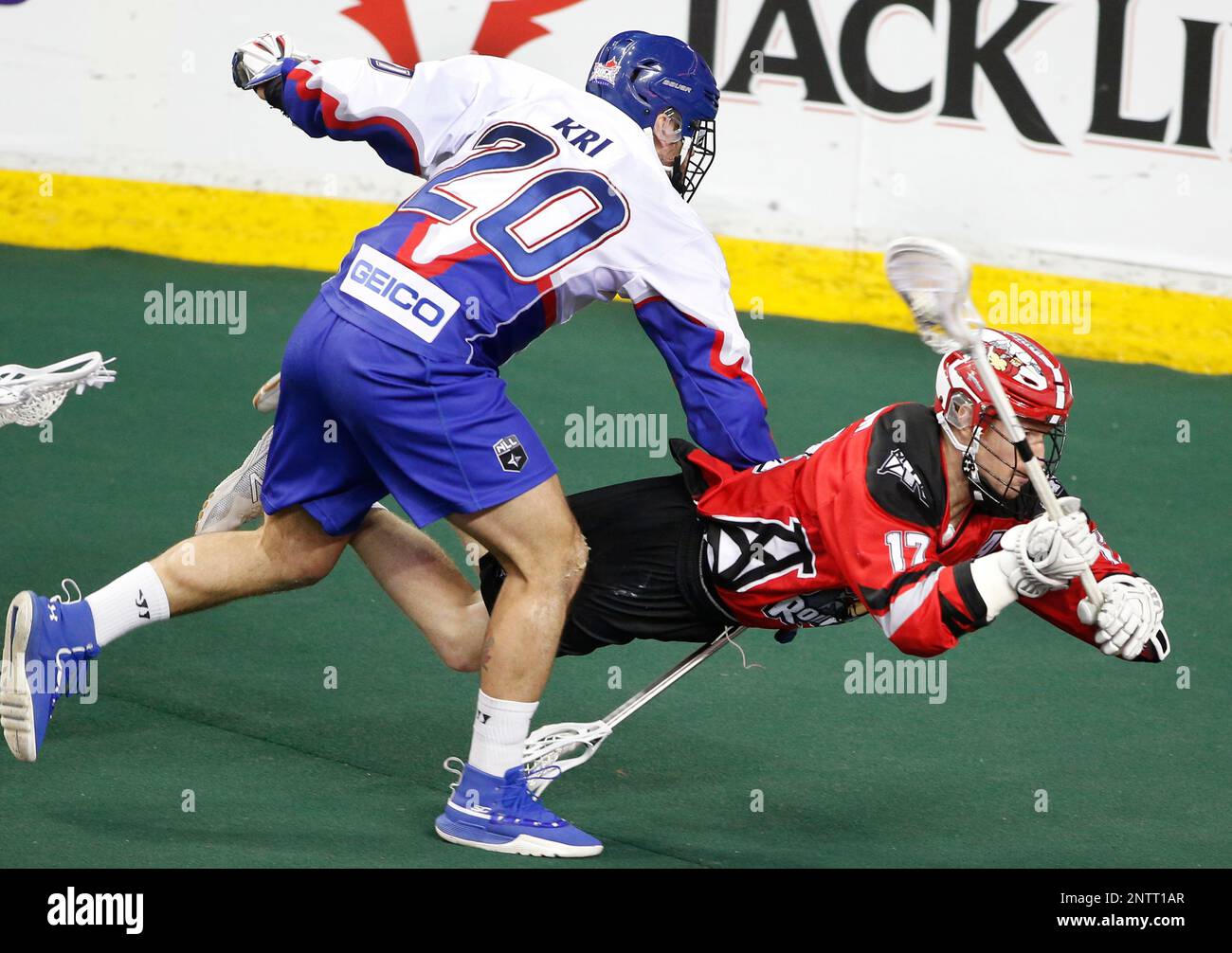 Calgary Roughnecks player Curtis Dickson, rt, goes horizontal with the