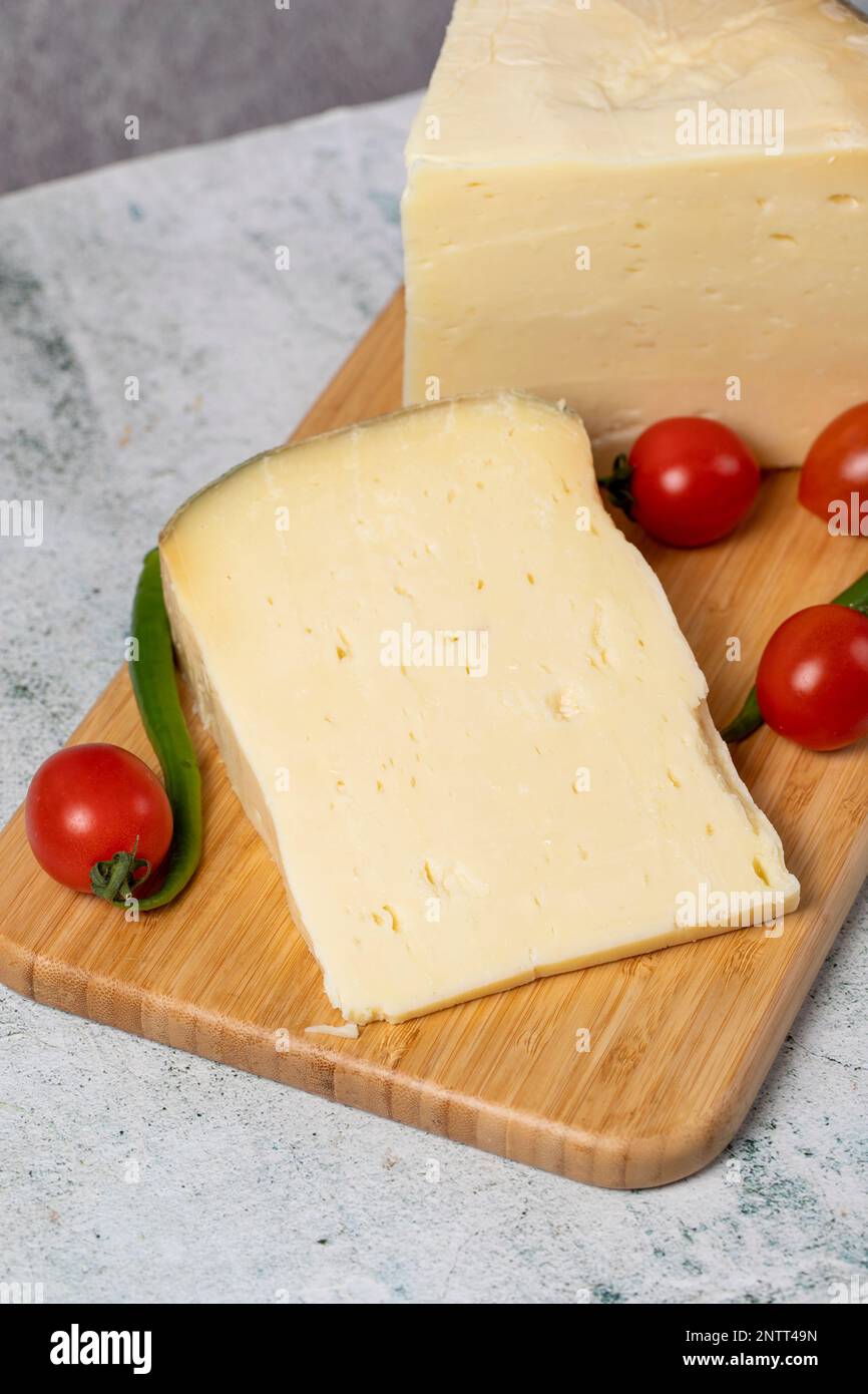 wheel cheese. Cheese made from cow's milk on a wooden flipchart