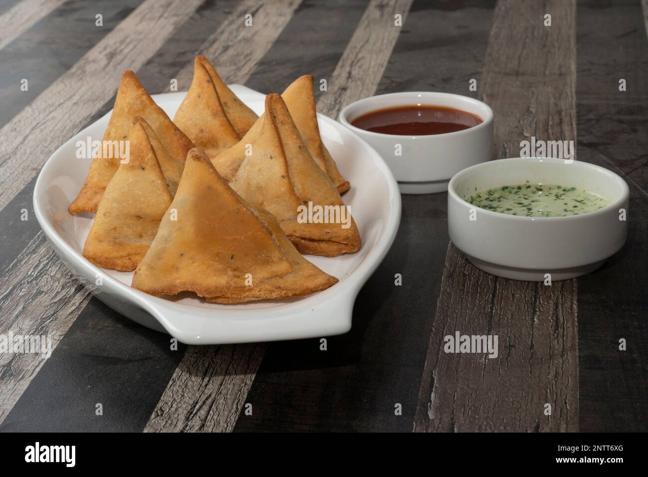 Potato Samosa Snacks on textured Background. Indian Ramadan Food