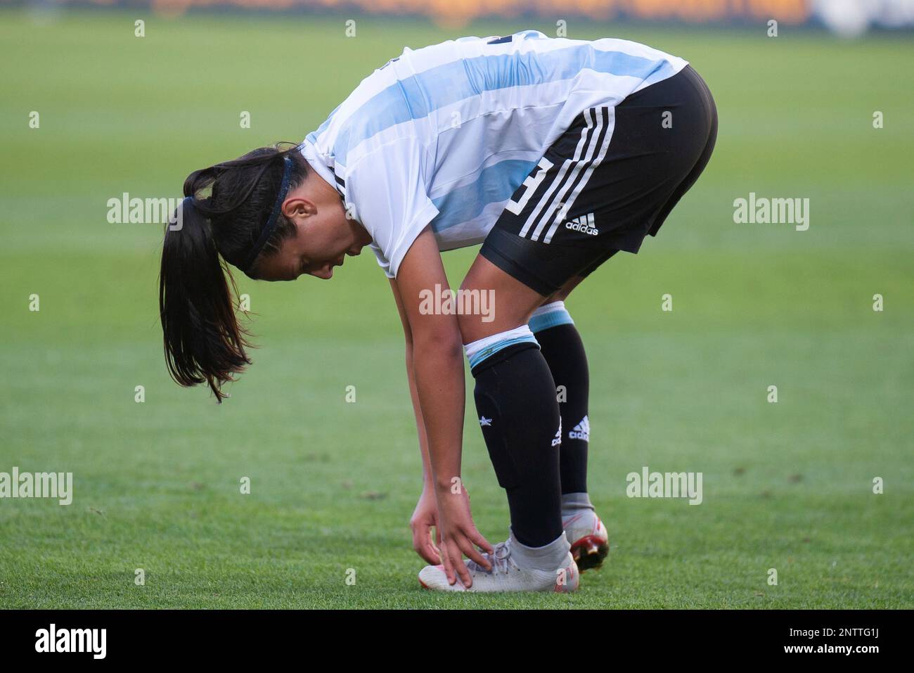MELBOURNE, VIC - MARCH 06: Eliana Stabile (3) of Argentina checks her foot  during The Cup of Nations womens soccer match between Australia and  Argentina on March 06, 2019 at AAMI Park,
