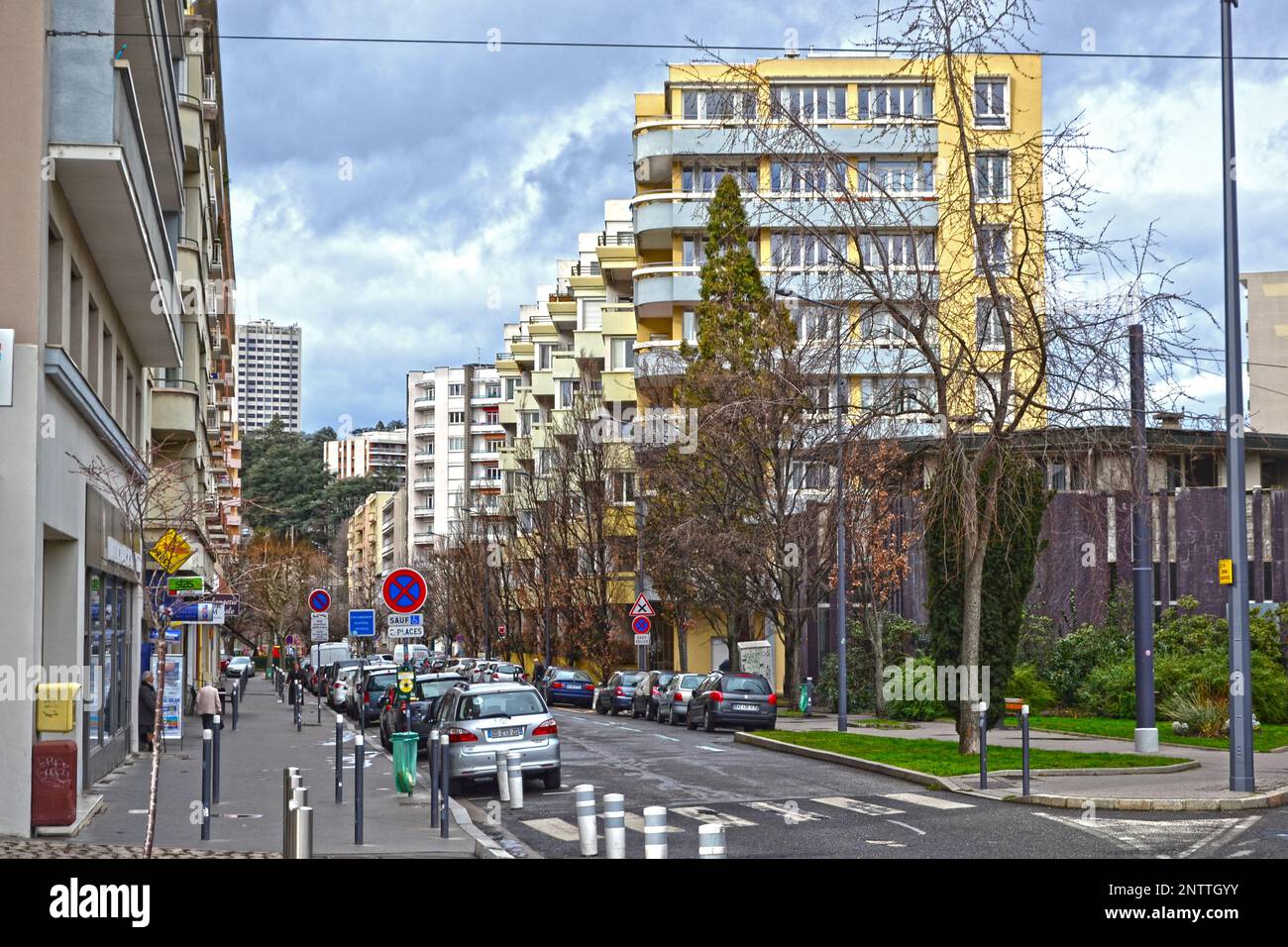 Saint-Etienne, France - January 27th 2020 : Focus on cyan and yellow modern buildings, known as 'HLM' in France. HLM are dwellings moderately rented. Stock Photo