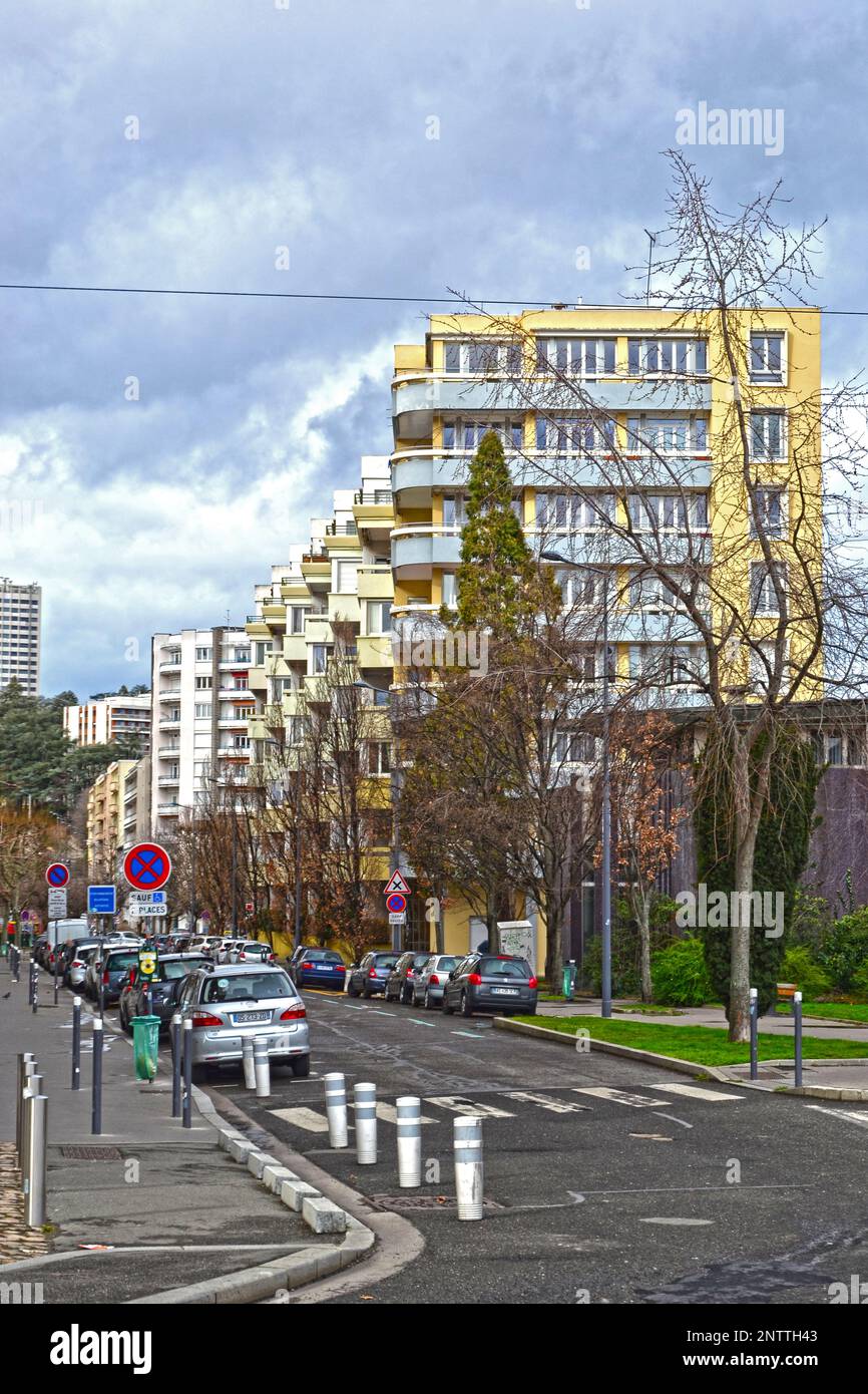 Saint-Etienne, France - January 27th 2020 : Focus on cyan and yellow modern buildings, known as 'HLM' in France. HLM are dwellings moderately rented. Stock Photo
