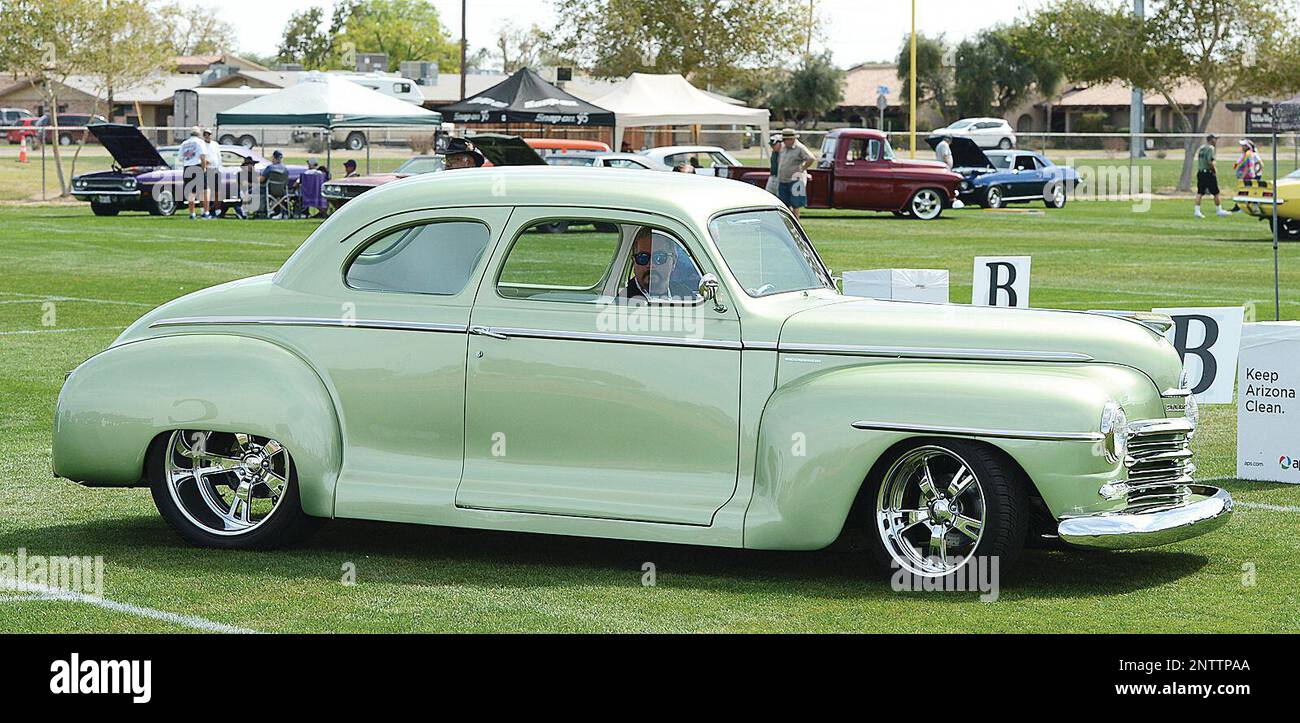 An entrant looks for a place to park his classic inside Ray Kroc