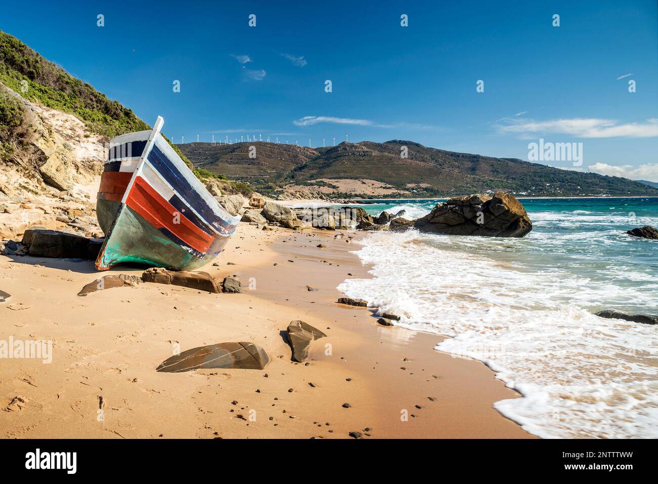 Wrecked wooden fishing boat at Puntapaloma beach, Tarifa, Cadiz Province, Andalusia, Spain Stock Photo