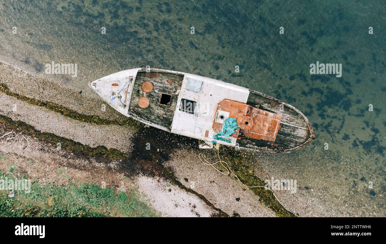 Corpach Shipwreck with Ben Nevis . Rusting remains of the MV Dayspring