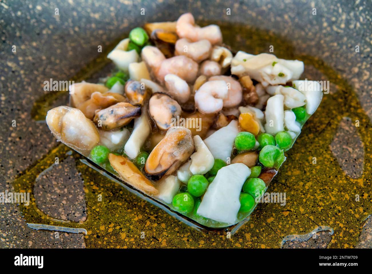 Cooking frozen food on a pan Stock Photo