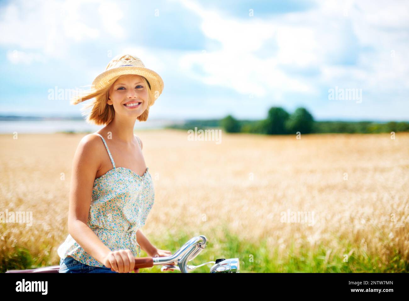 Keeping Fit And Feeling Great Cute Young Woman Riding A Bicycle In The keeping-fit-and-feeling-great-cute-young-woman-riding-a-bicycle-in-the