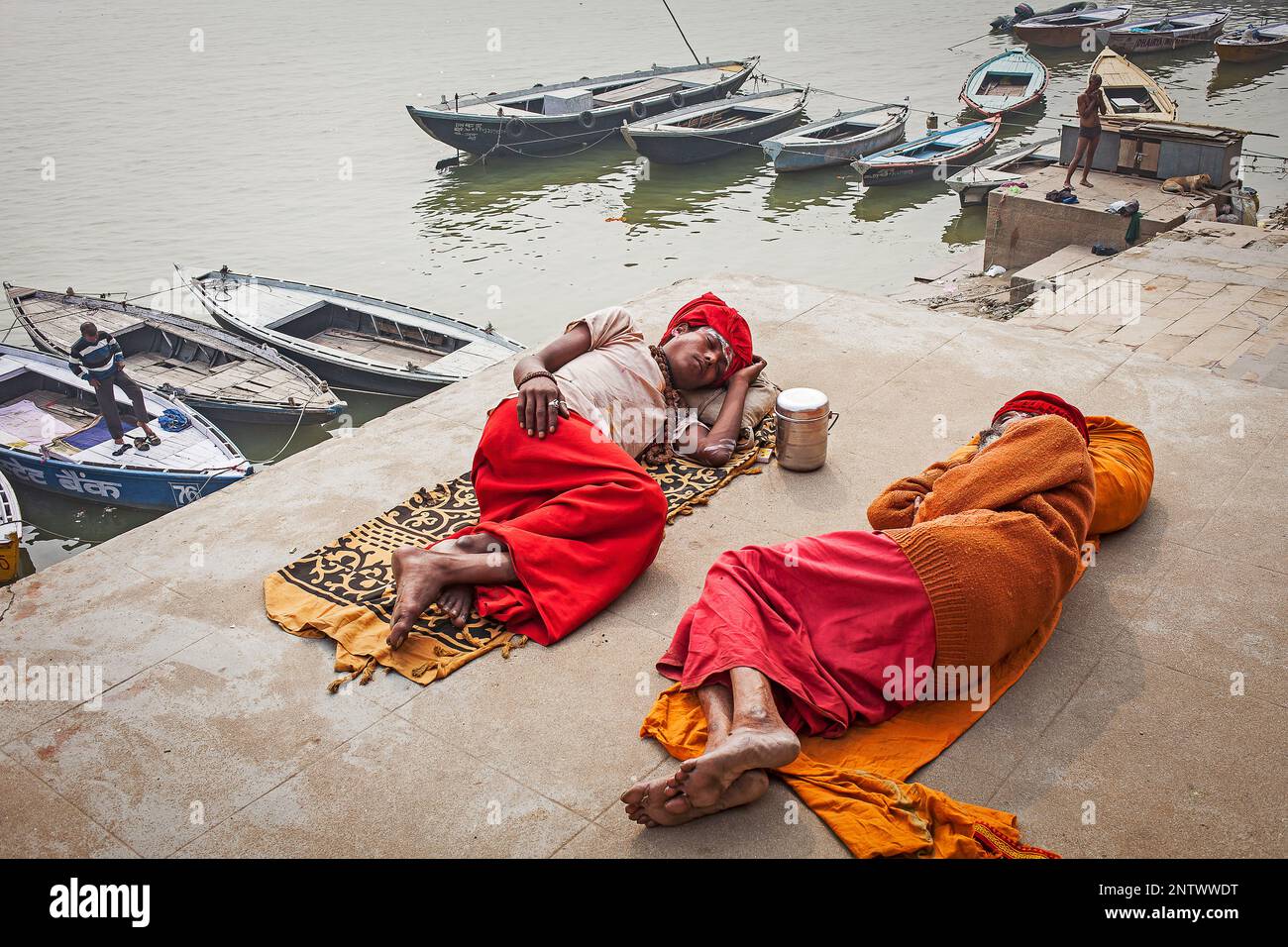 Sadhus sleeping, in the ghats of Ganges river, Varanasi, Uttar Pradesh, India. Stock Photo