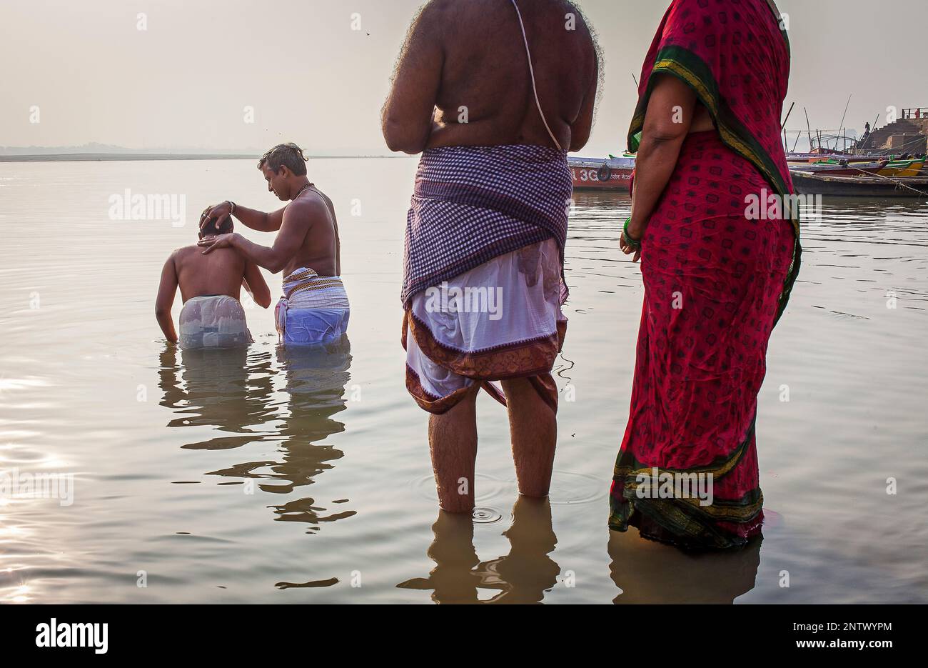Pilgrims Praying And Bathing In The Ghats Of Ganges River Varanasi Uttar Pradesh India Stock