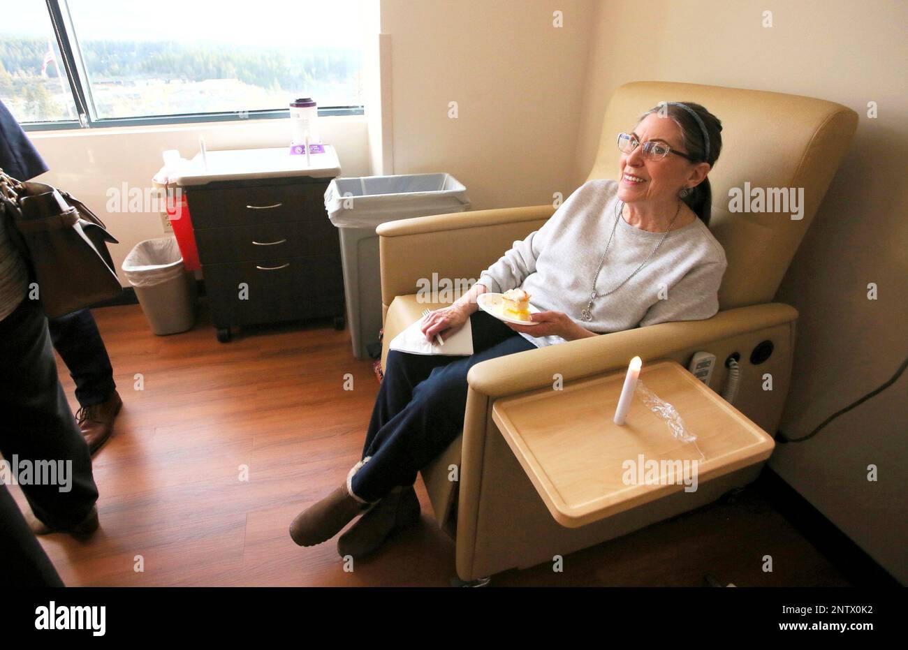 Grass Valley's Pam Baird smiles as she sits in one of the infusion