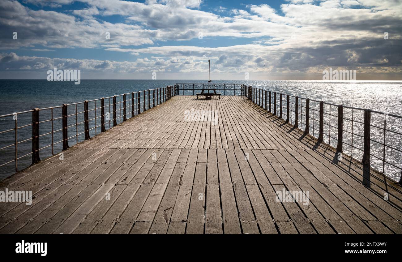 A view down Bognor Regis Pier in West Sussex, UK, looking out across the English Channel. Stock Photo