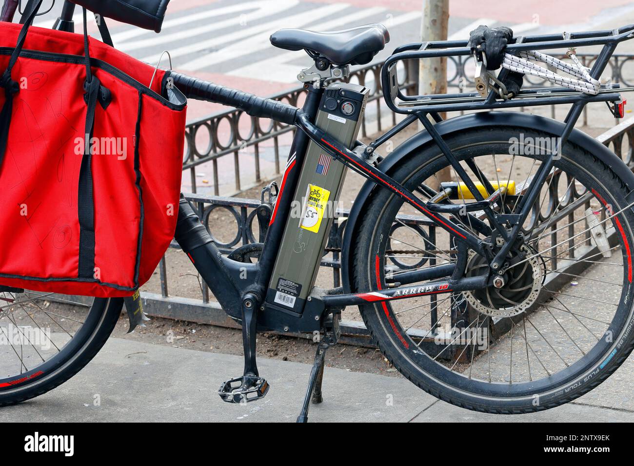 A lithium ion e bike battery installed in an electric bicycle. Stock Photo