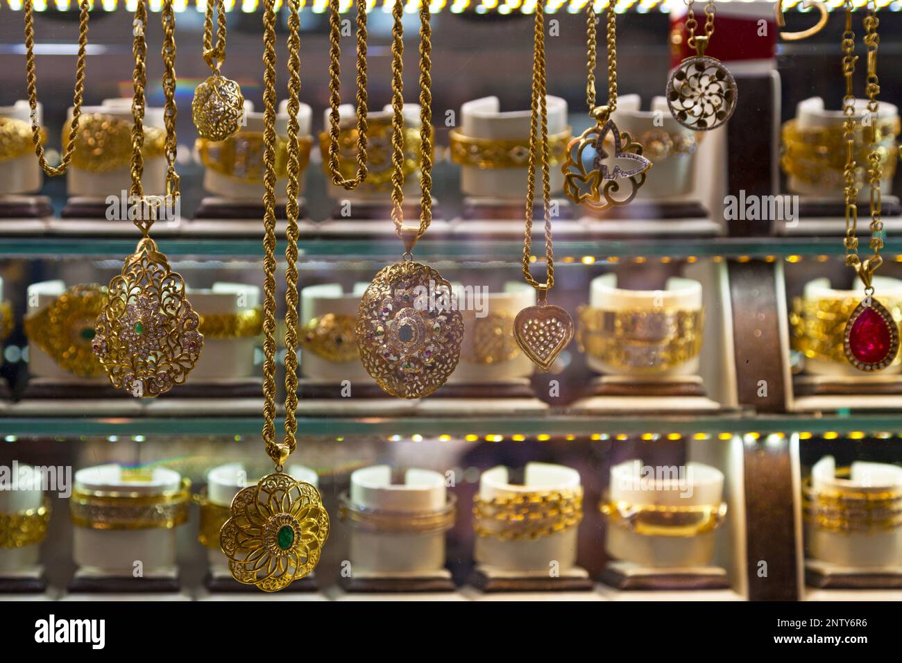 Gold jewelry for sale in the window of a jewelry shop in the old town of Fes, Morocco. Stock Photo
