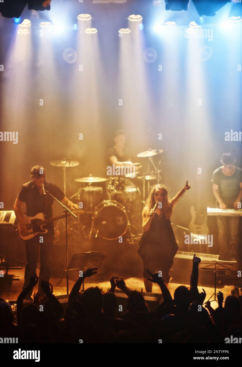 A rock band delivering a riveting performance. This concert was created ...