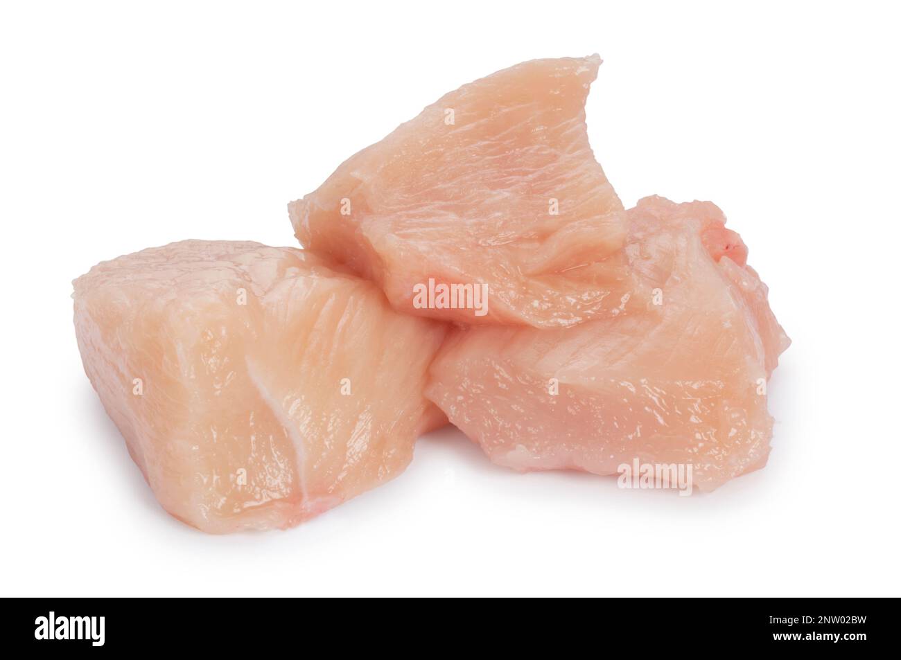 Studio shot of chopped chicken pieces cut out against a white background - John Gollop Stock Photo