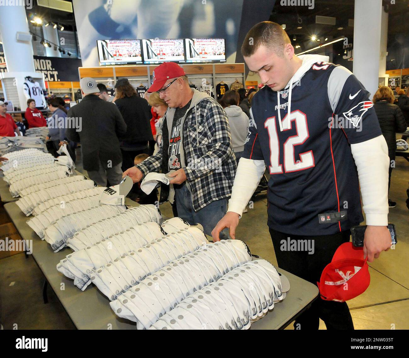 A steady stream of New England Patriots fans buy Super Bowl LIII  championship merchandise, mostly caps and t-shirts, at the Patriots Pro Shop  at Gillette Stadium in Foxboro, Mass., Monday, Feb. 4