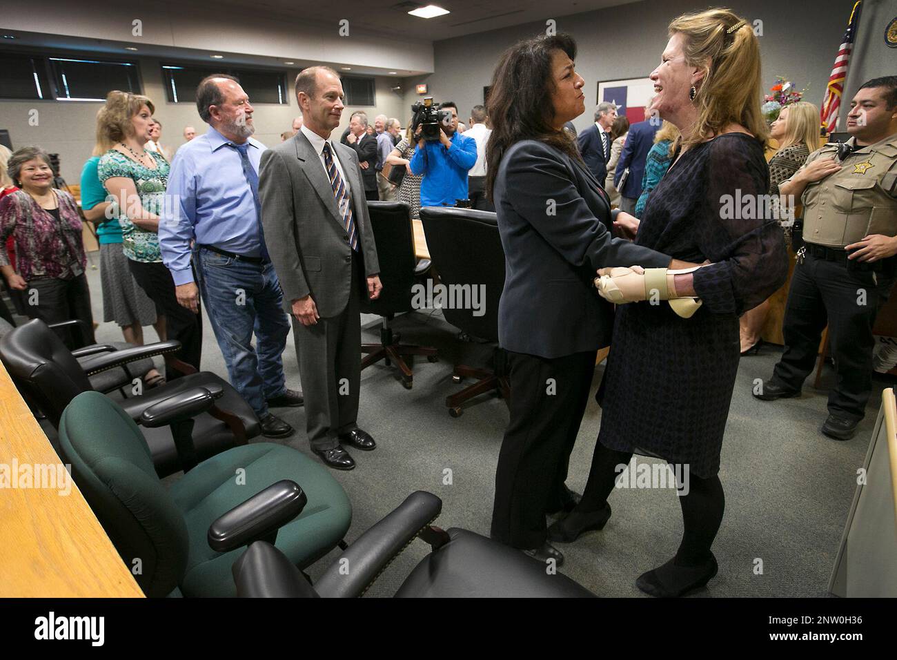 District Judge Julie Kocurek, right, was welcomed back to the 