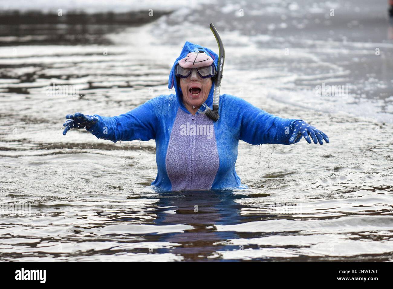 Mary Matunis, of Mahanoy City, Pa., reacts after jumping into the water during the 6th annual
