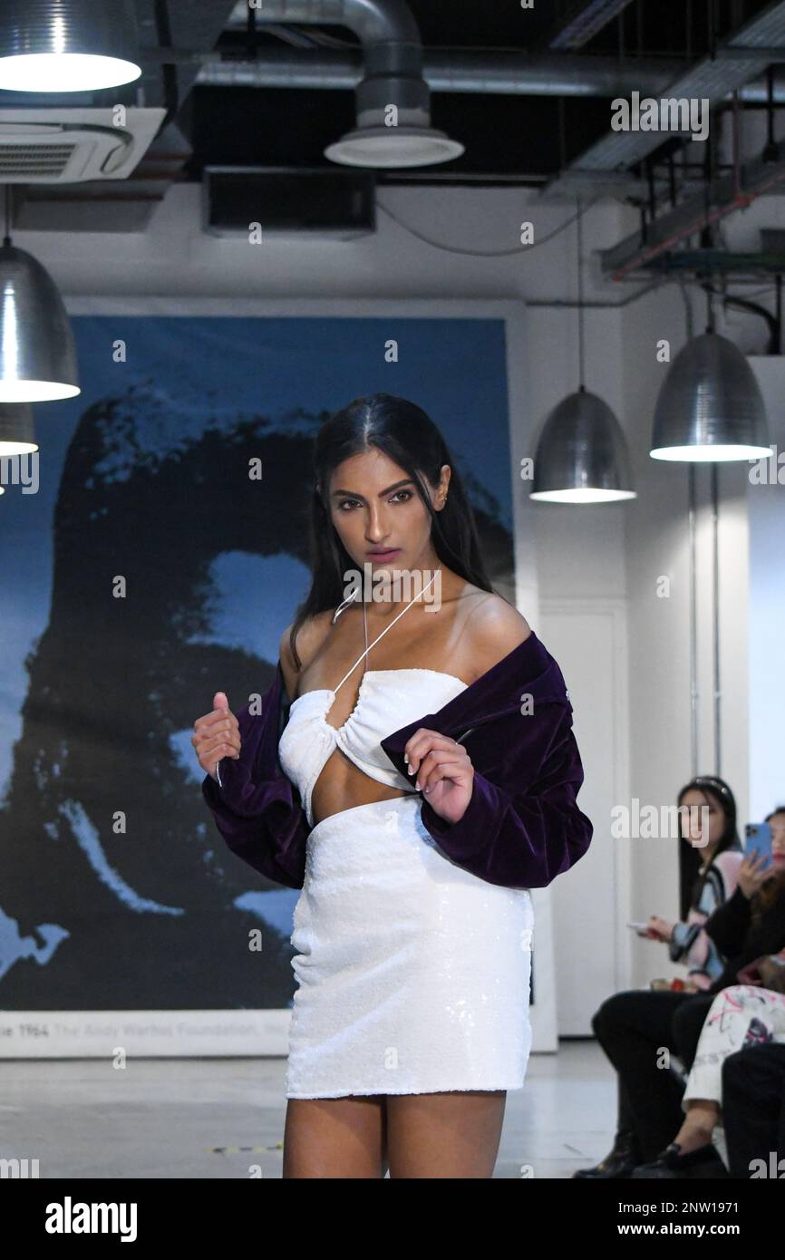 London, UK, 19th February 2023, LAN Fashion show was held in Croydon with London-based fashion designer Ettie. Ettie is a UK-based luxury handmade clothing brand founded by Juliette Stephenson. Ettie specialises in feminine party wear with pop colours and fun fabrics., Andrew Lalchan Photography/Alamy Live News Stock Photo