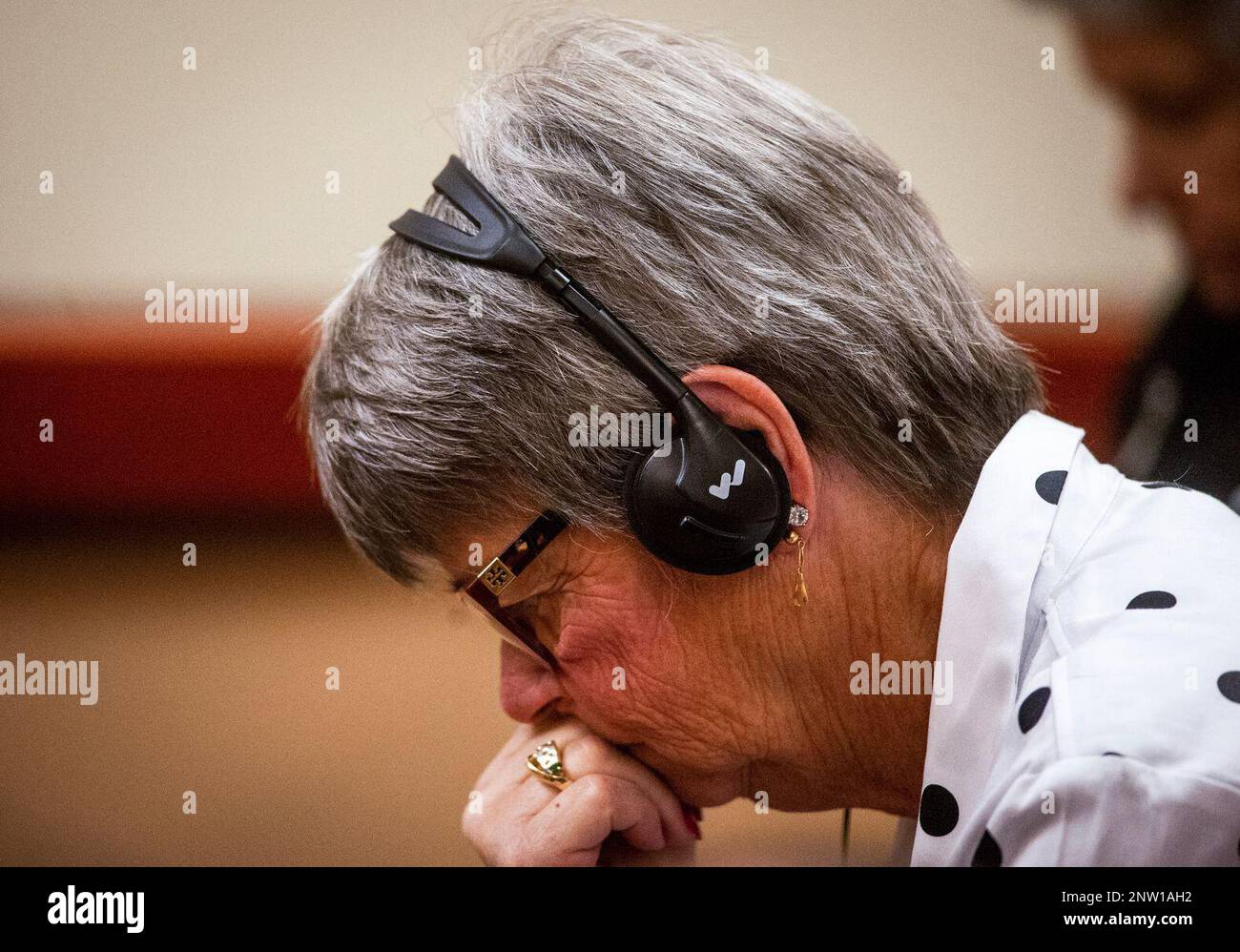 Pattie Bastian, Jennifer Bastian's mother, listens as Robert Washburn