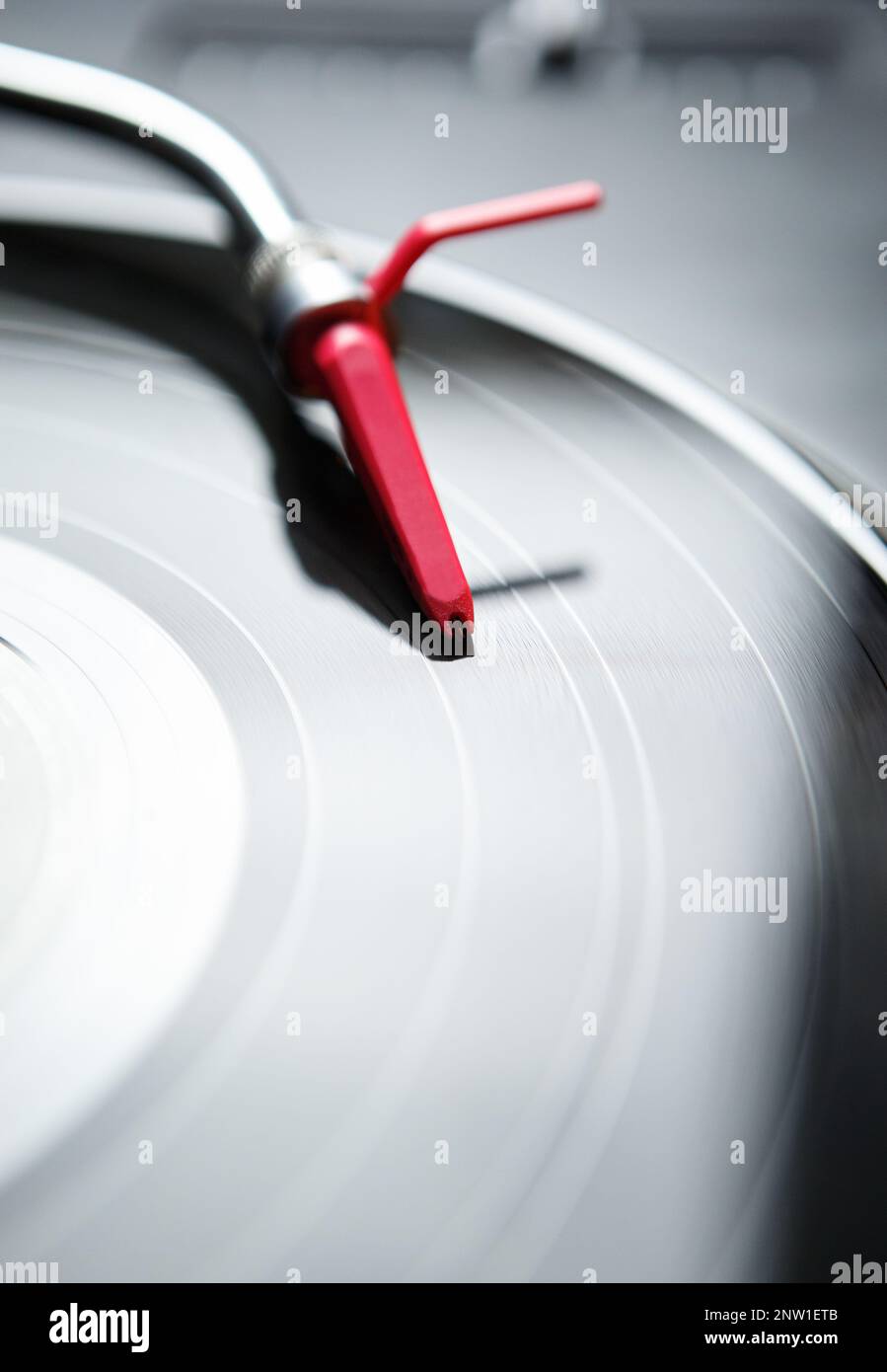 Retro turntable player in close up.Red needle cartrdige on black analog ...