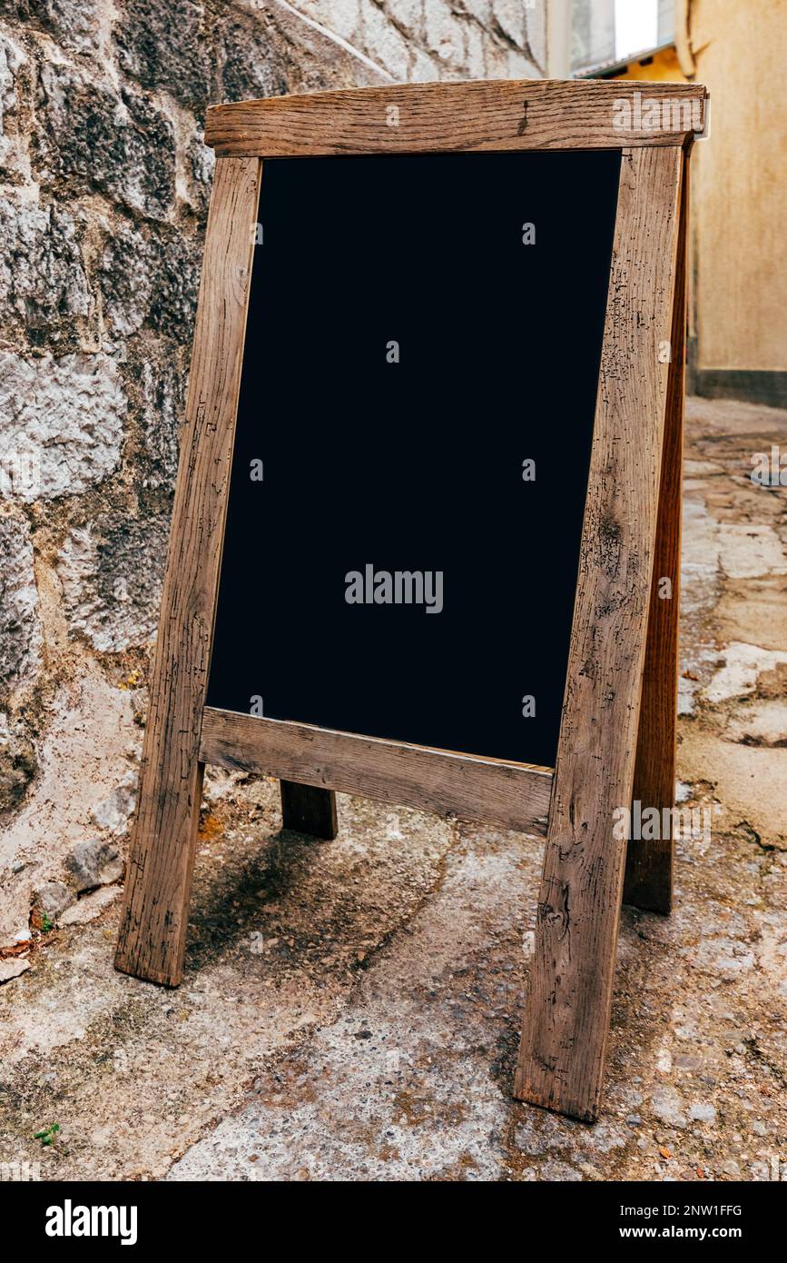 Cafe restaurant chalkboard mockup, blank information board on streets of Lovran old town, selective focus Stock Photo