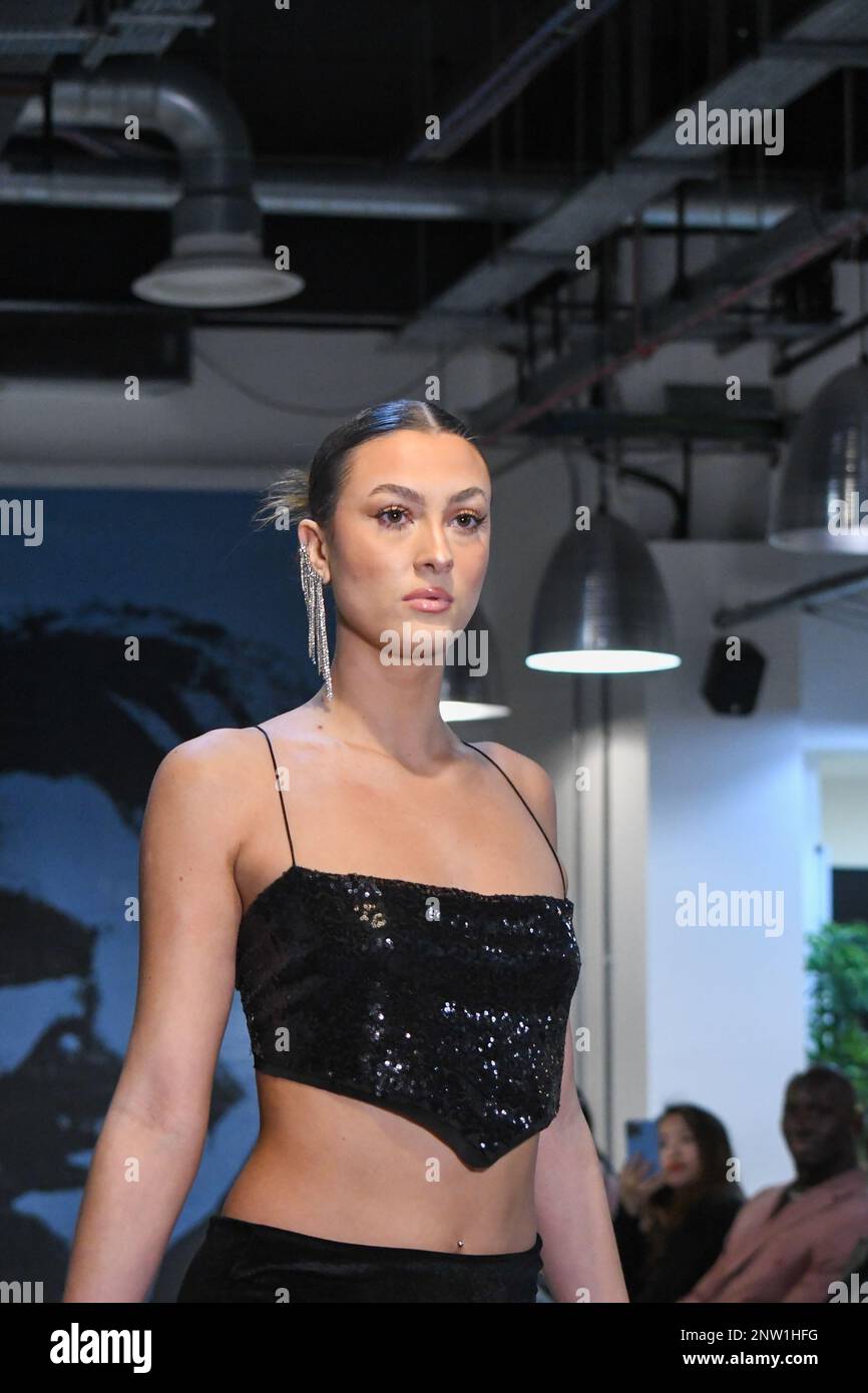 London, UK, 19th February 2023, LAN Fashion show was held in Croydon with London-based fashion designer Ettie. Ettie is a UK-based luxury handmade clothing brand founded by Juliette Stephenson. Ettie specialises in feminine party wear with pop colours and fun fabrics., Andrew Lalchan Photography/Alamy Live News Stock Photo