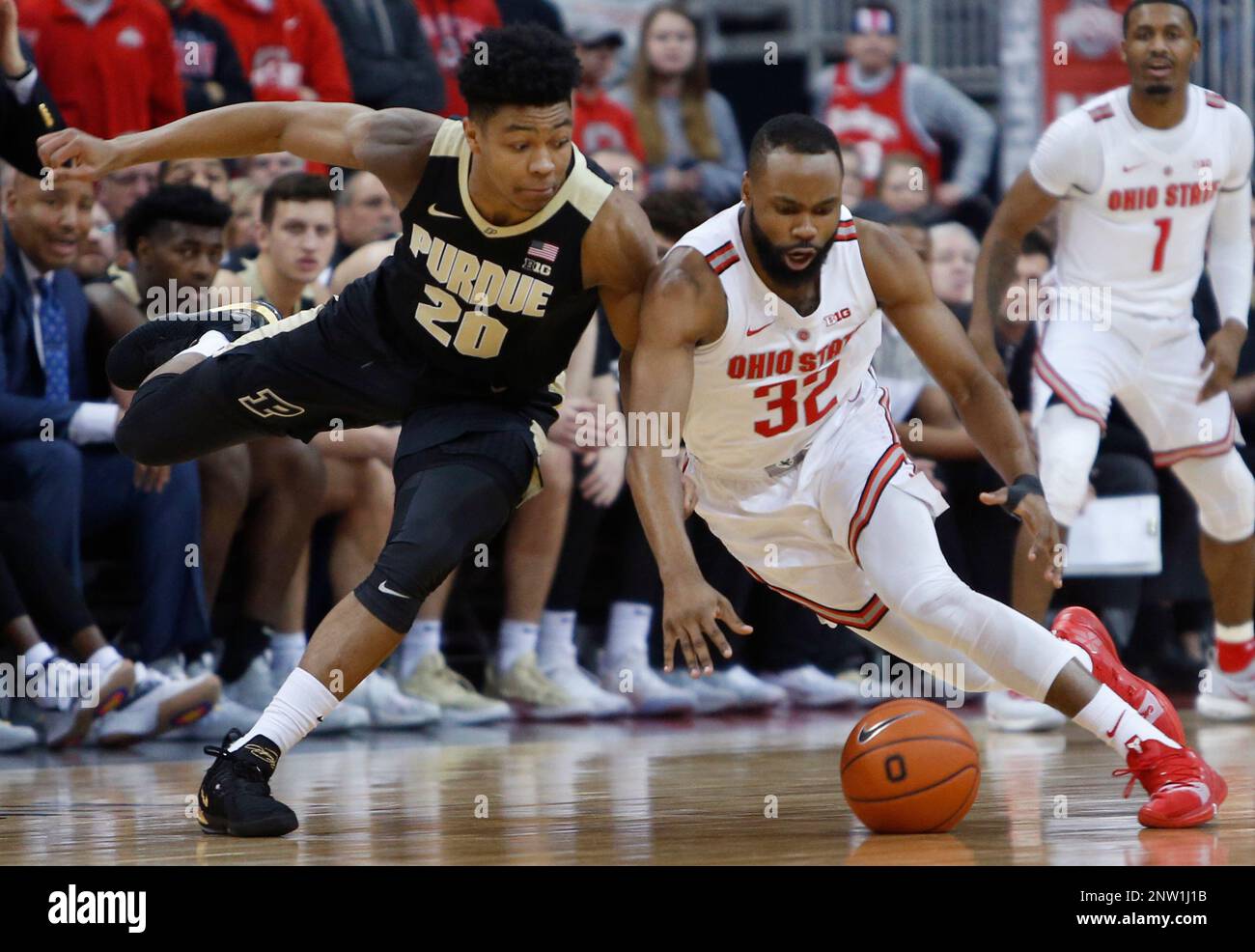 Purdue's Nojel Eastern, left, and Ohio State's Keyshawn Woods chase the ball during the first
