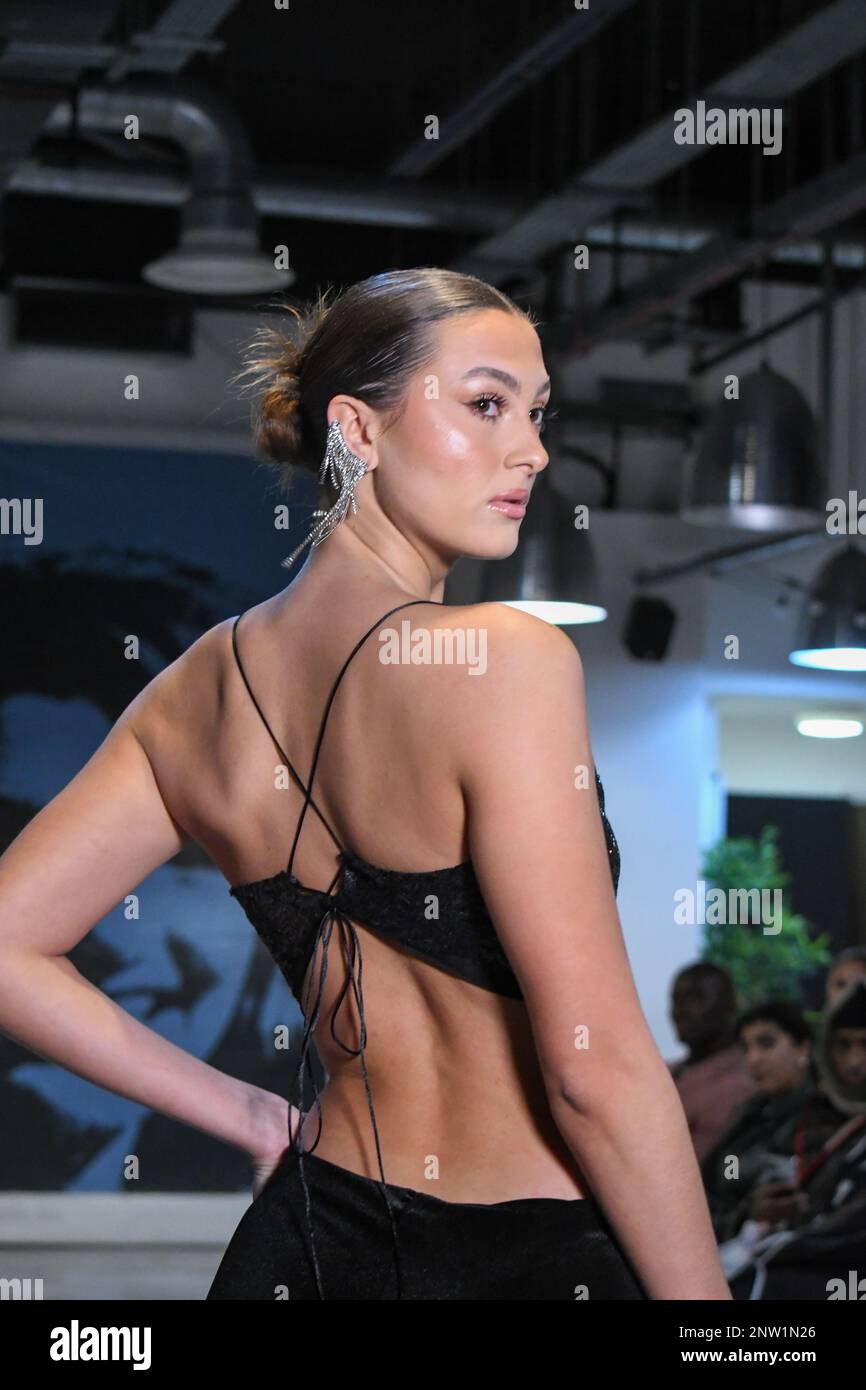 London, UK, 19th February 2023, LAN Fashion show was held in Croydon with London-based fashion designer Ettie. Ettie is a UK-based luxury handmade clothing brand founded by Juliette Stephenson. Ettie specialises in feminine party wear with pop colours and fun fabrics., Andrew Lalchan Photography/Alamy Live News Stock Photo