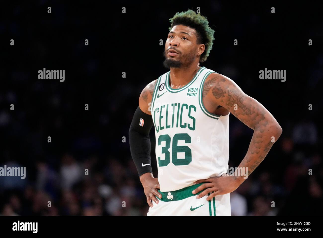 Boston Celtics guard Marcus Smart (36) stands on the court during the