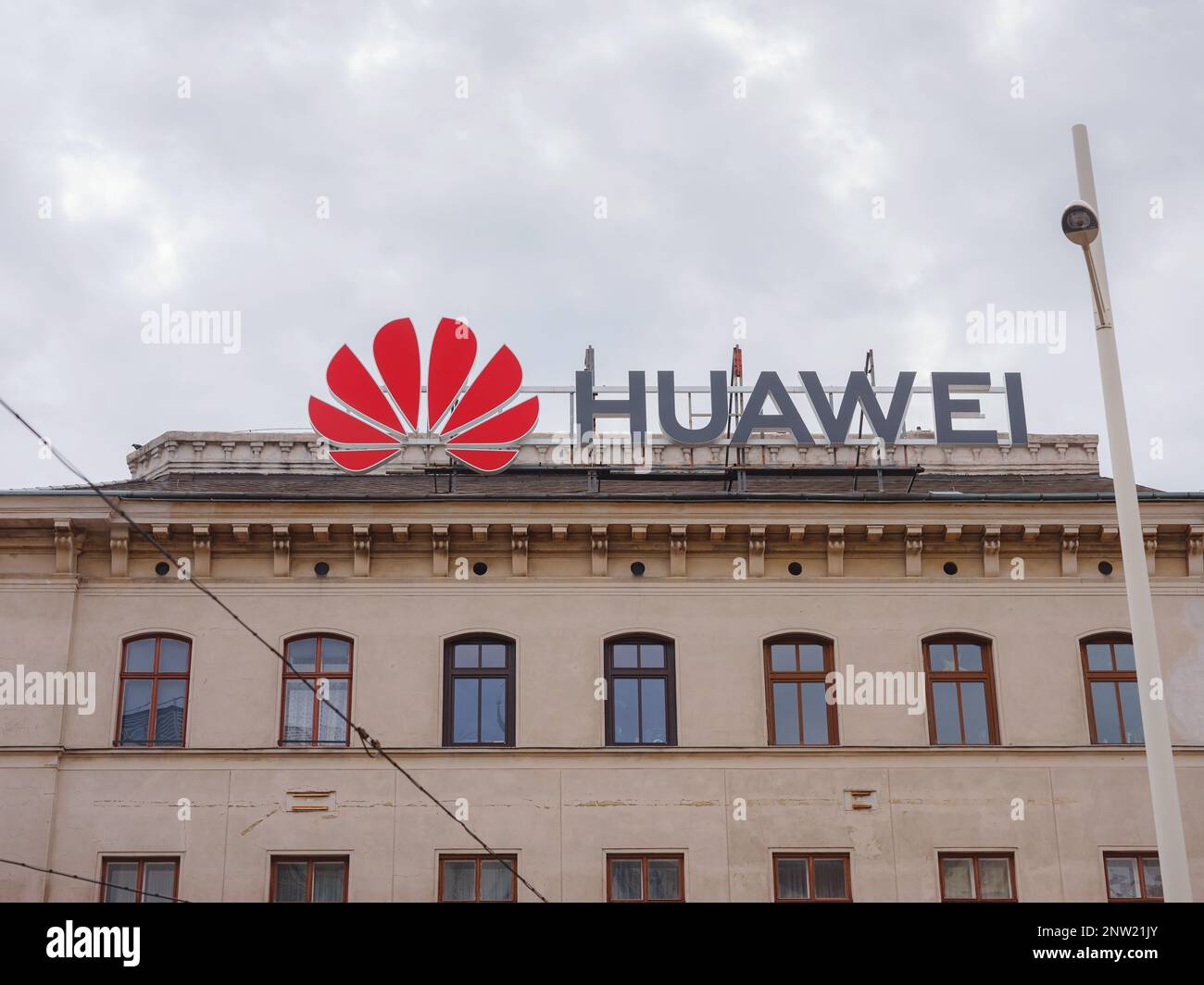 Vienna, Austria - August 7, 2022: Huawei logo on old building wall. Huawei is leading global provider of information and communications technology infrastructure and smart devices Stock Photo