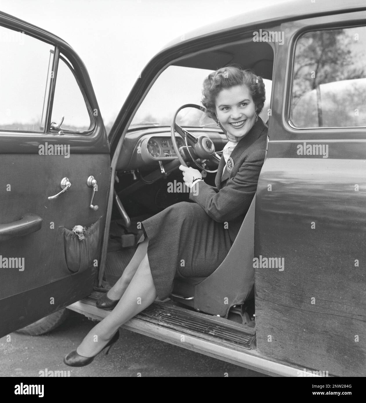 In the 1950s. A woman pictured in the driving seat of a car. Sweden april 1954 Stock Photo
