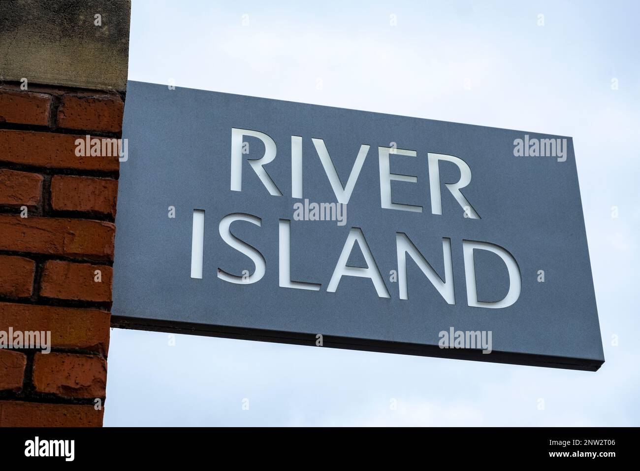 Close up of River Island Fashion shop sign on outside wall UK Stock Photo