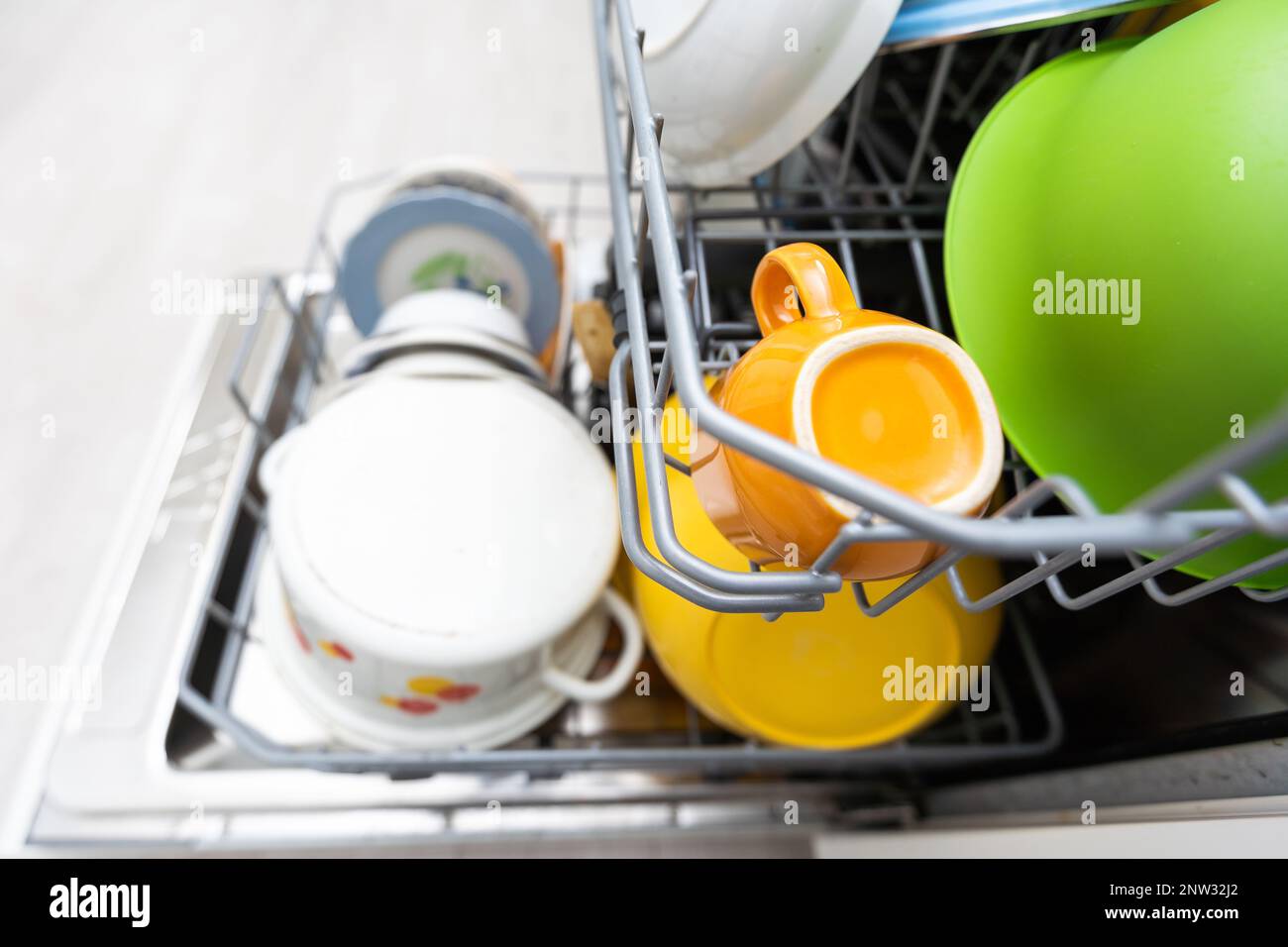 dishwasher closeup with washed dishes, easy to use and save water, eco
