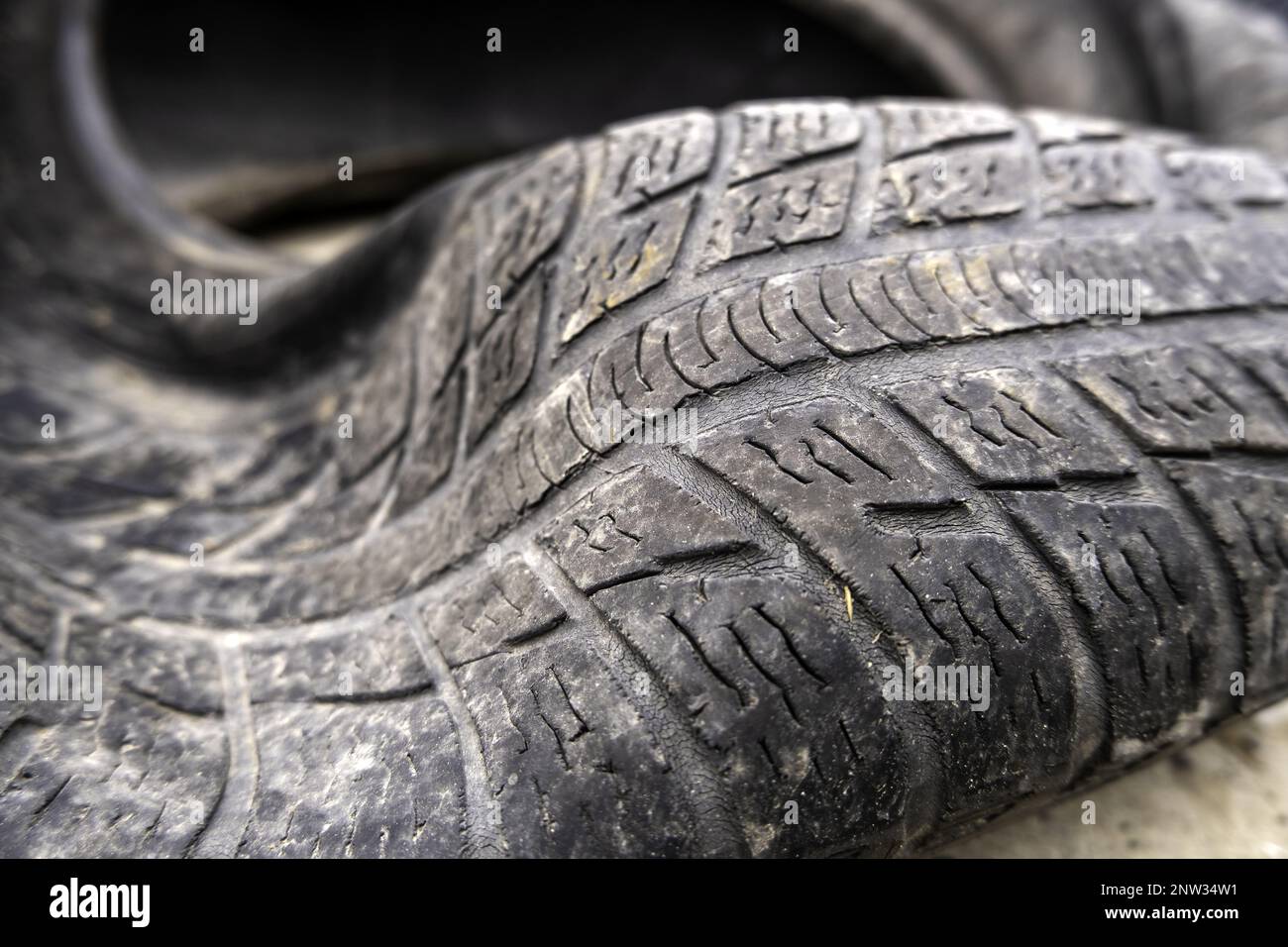 Detail of tires in the trash, pollution and dirt, recycling Stock Photo